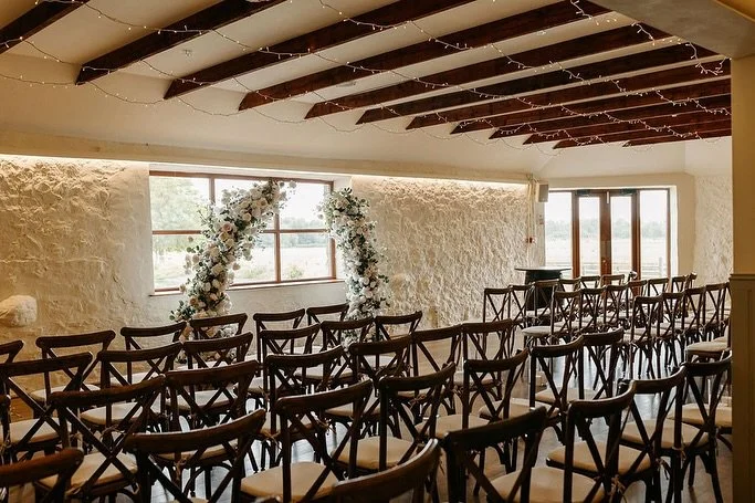 Ceremonies in Bachilton 🤍✨

Bachilton is a ceremony space that has it all. Fairy lights overhead, natural oak floors, rustic stone walls and natural light with stunning views of the countryside and pond. 

A room full of so much character you can ke