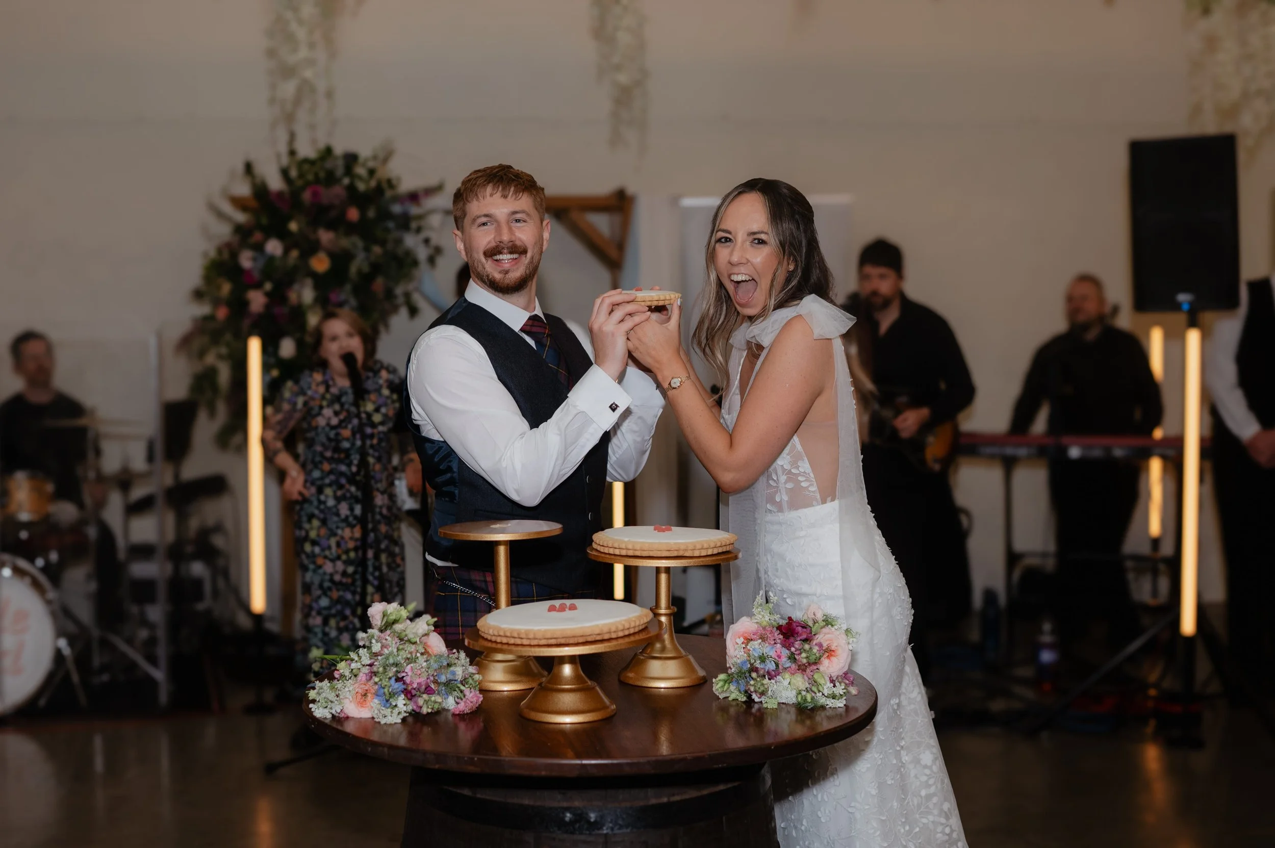 High-energy evening wedding reception and party atmosphere inside the Bachilton Barn.