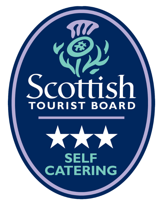 Scottish Tourist Board logo with a thistle, three stars, and the words Self Catering in white and green on a blue oval background.