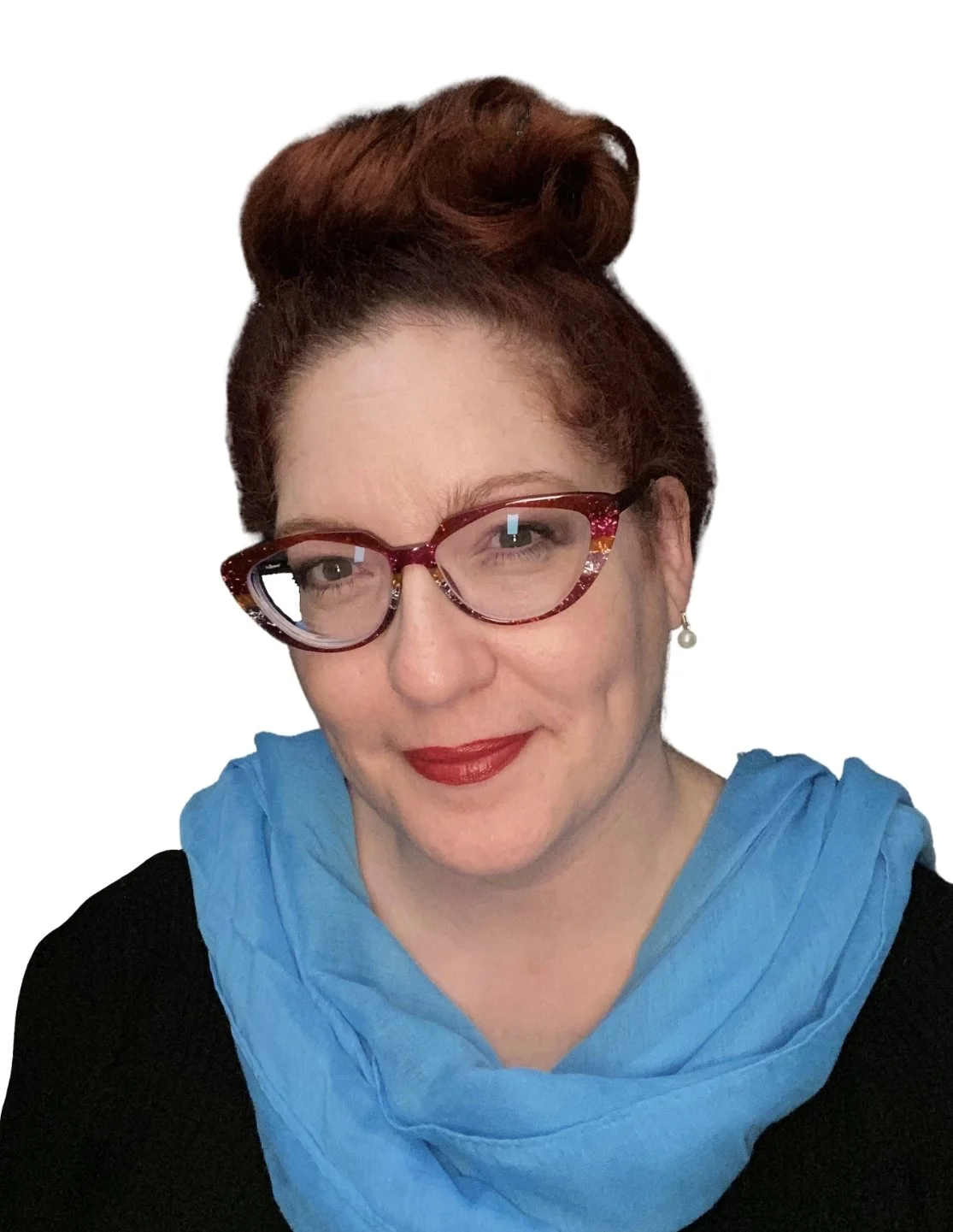 Sam is a middle aged white female with dark red hair in an “up” hair do and cat eye shaped glasses. She is wearing a turquoise blue scarf and a black jumper. She is smiling and looking at the camera.