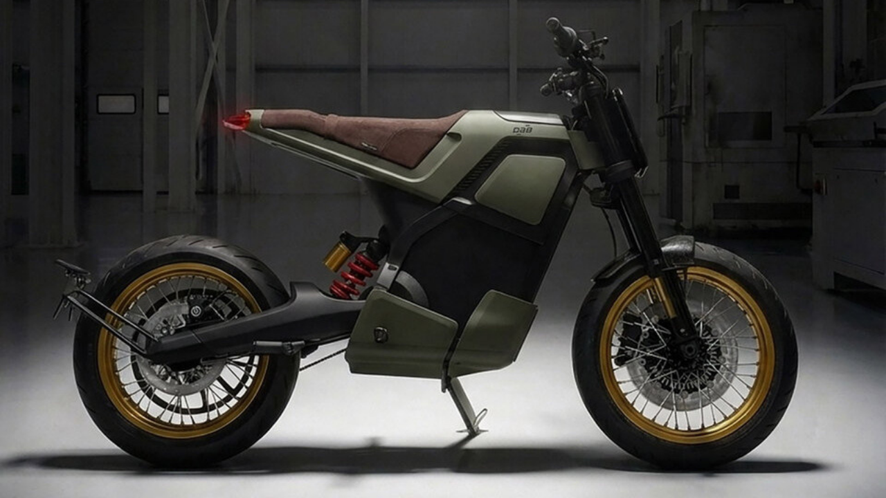 Olive green DAB 1 electric motorcycle with gold rims in a dark workshop. Sleek urban mobility.
