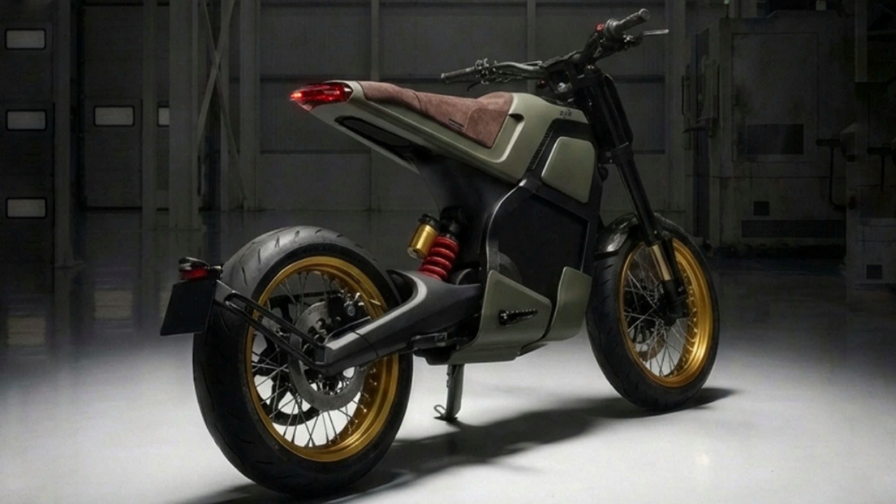 Olive green DAB 1 electric motorcycle with gold rims and brown seat in a dark workshop. Tactical urban mobility.