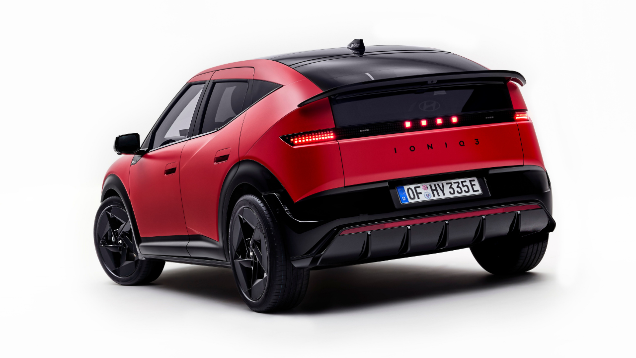 Rendering of red Hyundai Ioniq 3 N rear with pixel LED taillights and black diffuser on white background.