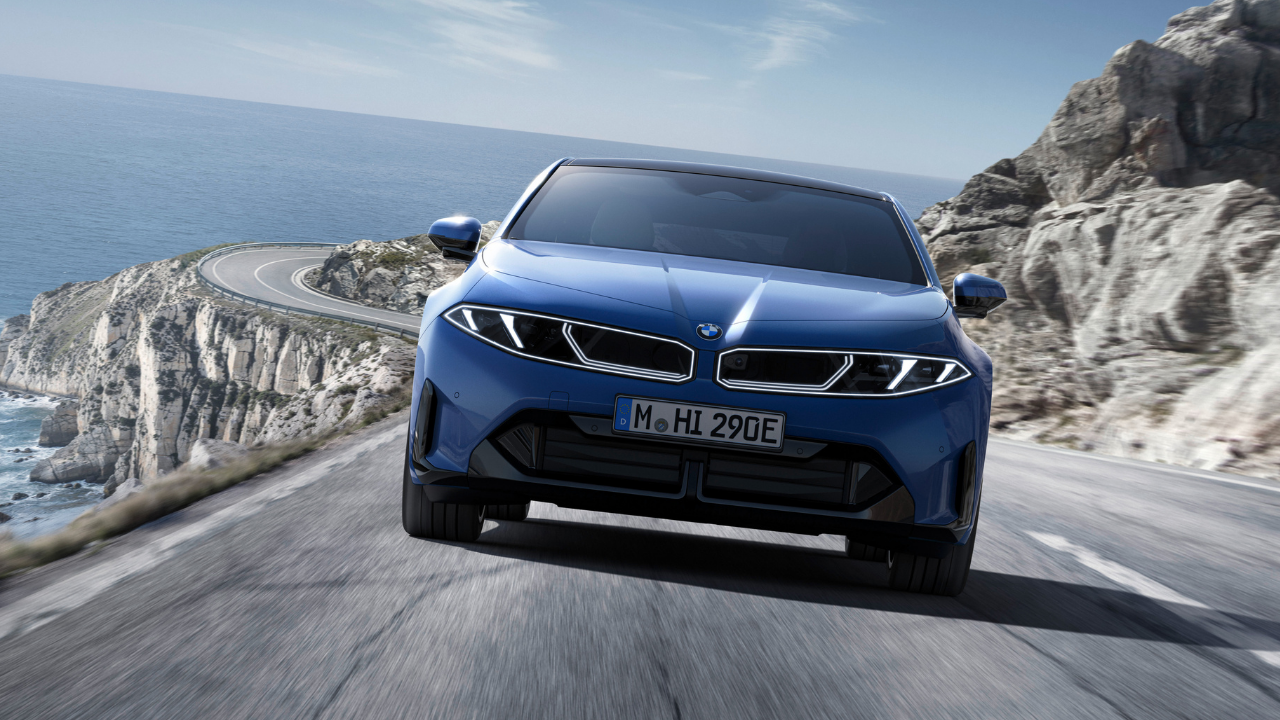 Rendering of a blue BMW EV driving on a coastal cliff road, showcasing modern BMW electric performance.