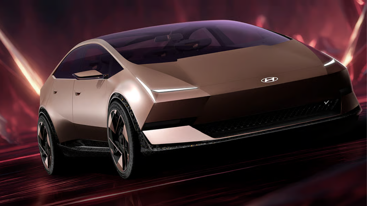 Rendering of the gold Hyundai Venus concept in a red abstract landscape for future EV design trends.