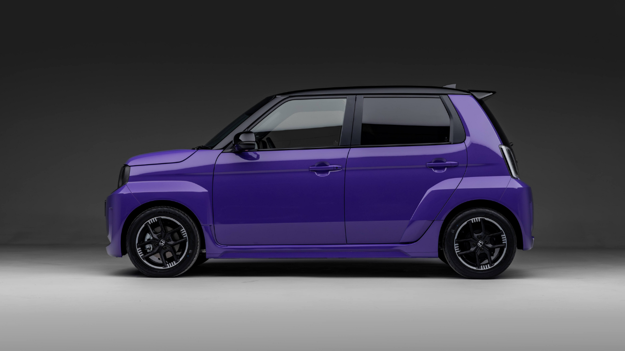 Rendering of a purple Honda Super-N electric car side profile in a gray studio.