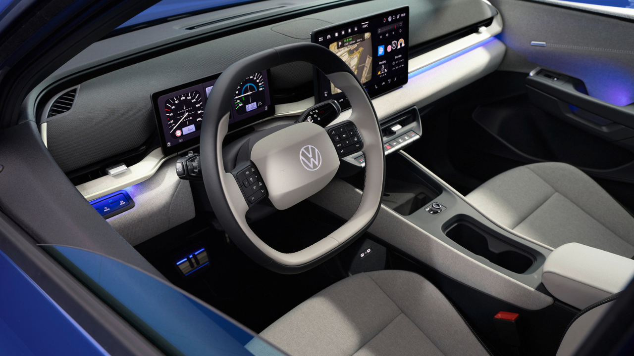 Modern interior of blue Volkswagen ID. Polo with dual digital screens and light gray seats for the id polo ev.