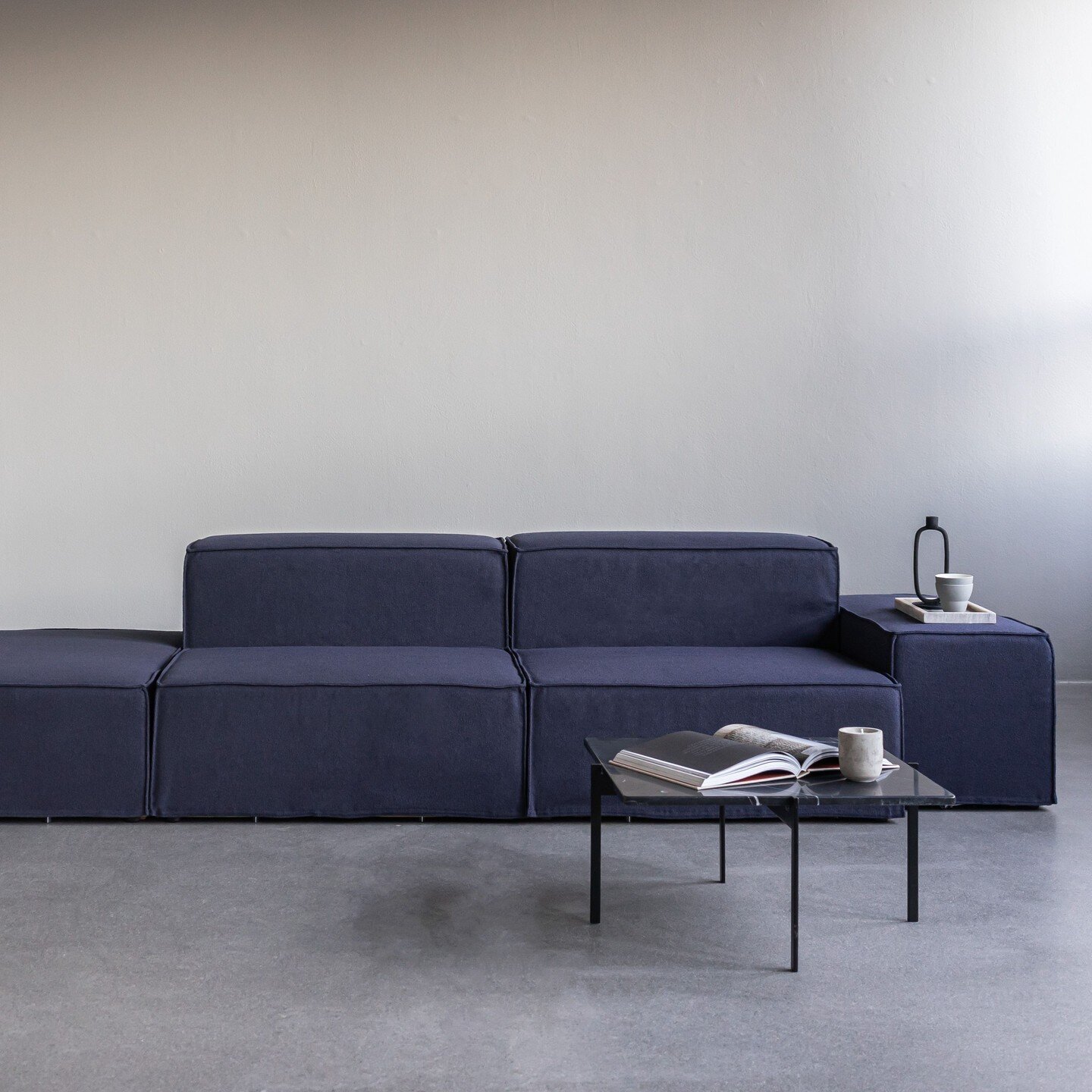 PB Sofa with removable boucle fabric in deep blue. PB3 Black frame / Nero Marble. 
Doing these deep color scales is bold and probably not fit for every home out there.