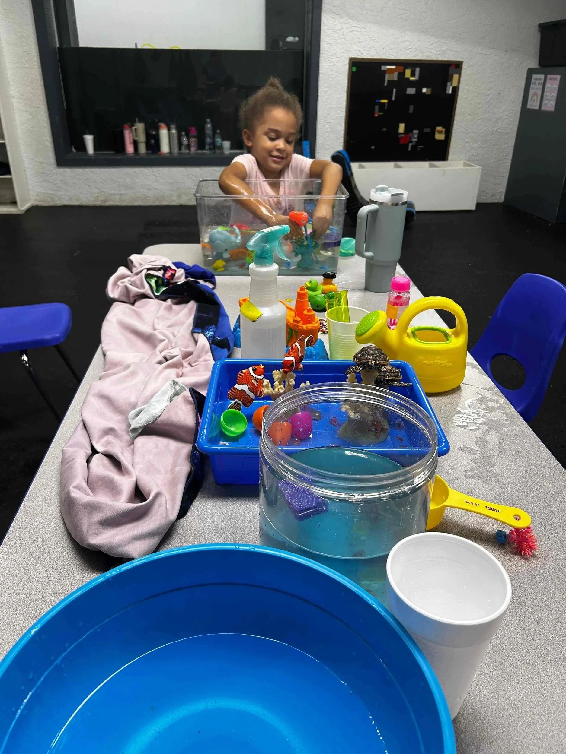 Child completing a hands-on functional activity with everyday objects during pediatric occupational therapy at Apollo Beach Therapy Center.