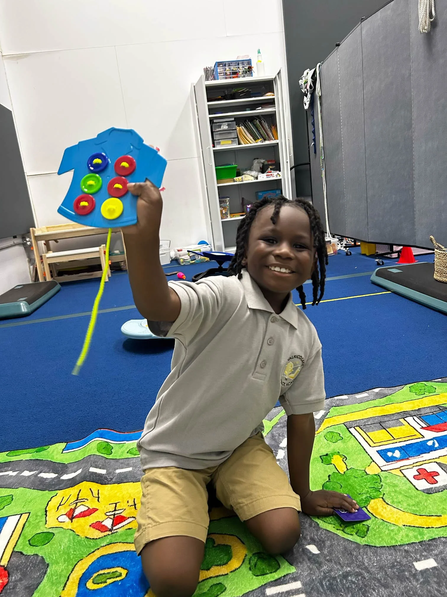Child displaying a completed hands-on project during pediatric occupational therapy at Apollo Beach Therapy Center.