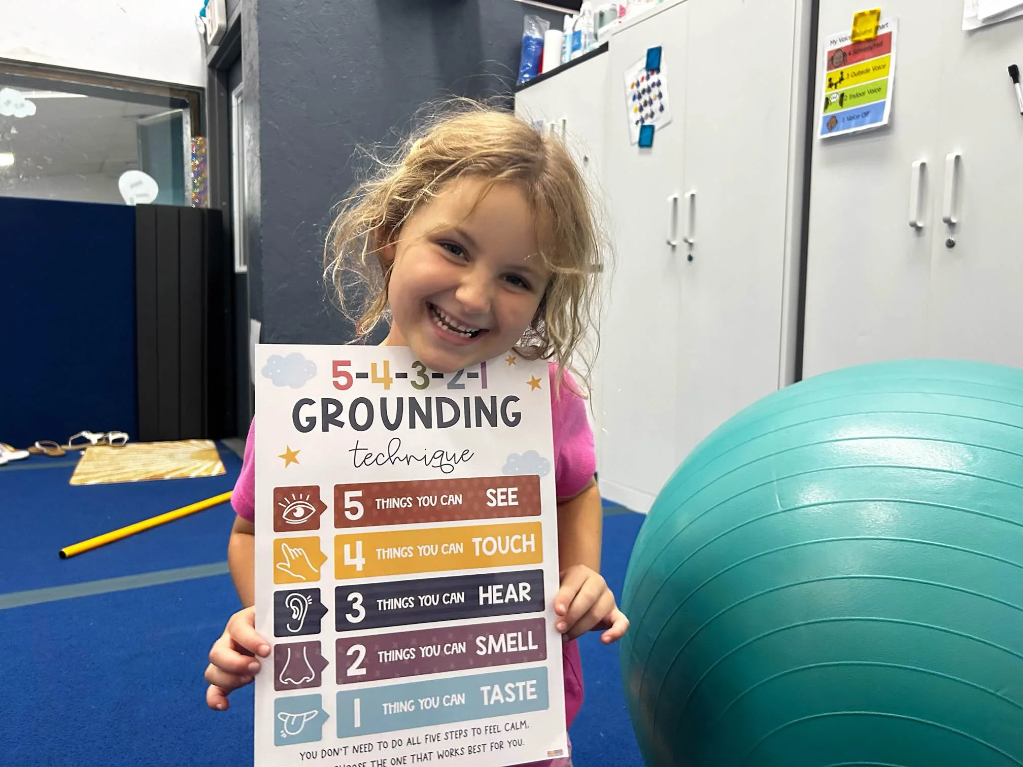 Child practicing a grounding and emotional regulation strategy during pediatric occupational therapy.