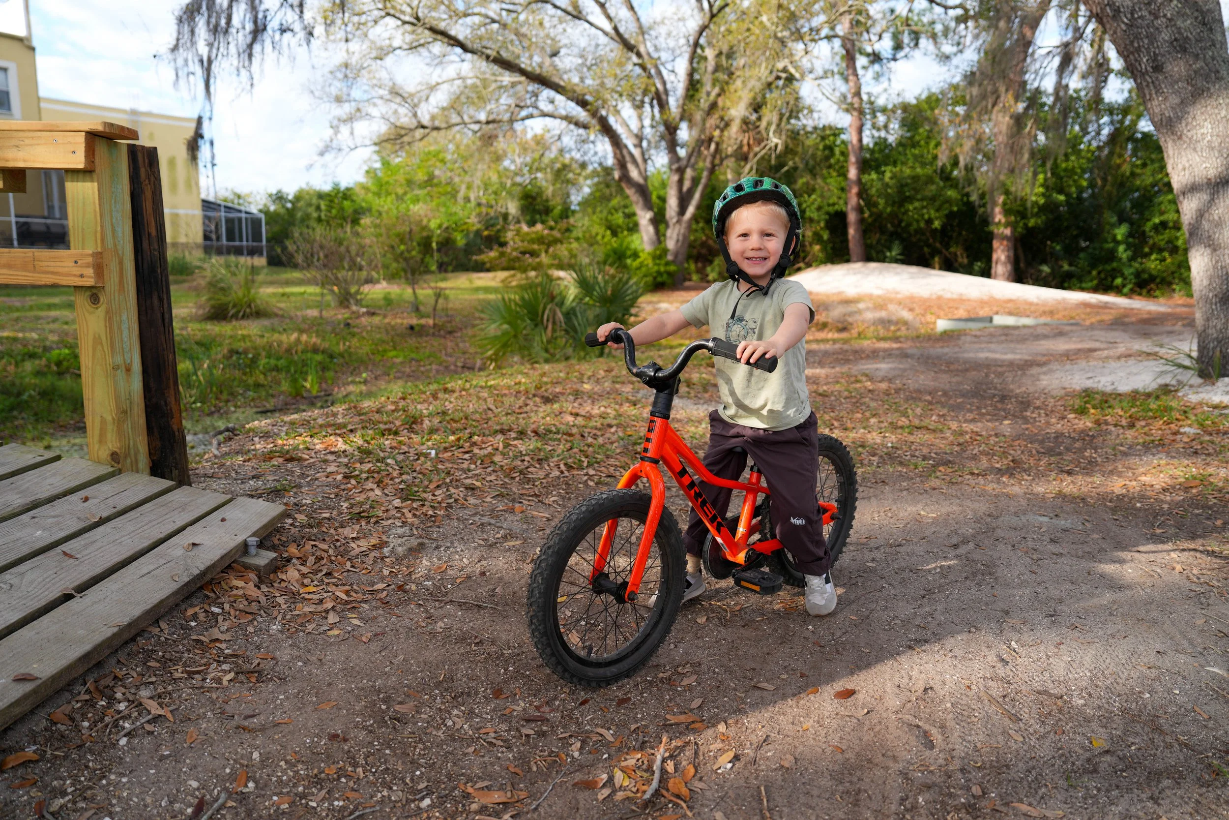Child practicing balance, coordination, and bike-riding skills during occupational therapy at Apollo Beach Therapy Center.