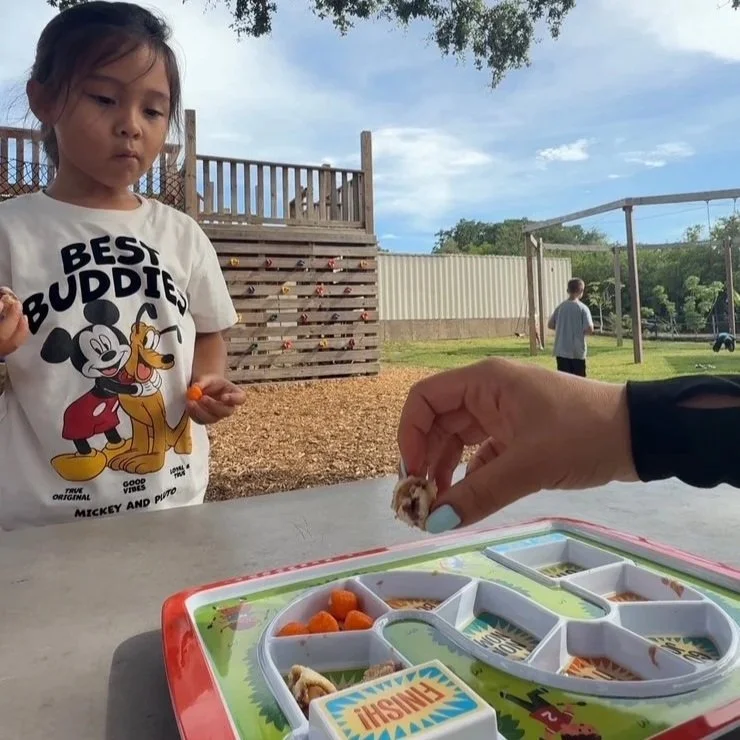 Child participating in feeding therapy with food exploration activities at Apollo Beach Therapy Center.