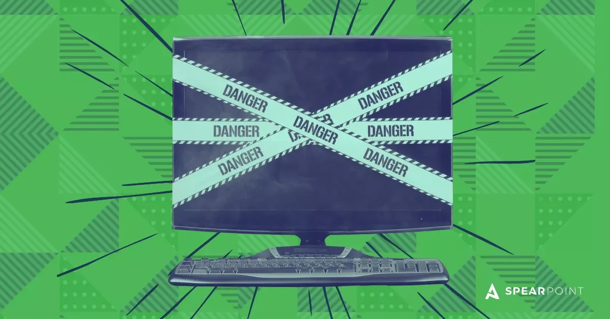 Why SEO Website Migrations Are High Risk graphic showing a desktop monitor covered with danger tape on a green patterned background, with SpearPoint branding.