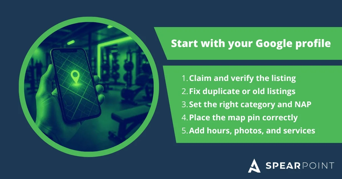Hand holding a phone showing a map with a location pin, inside a gym.