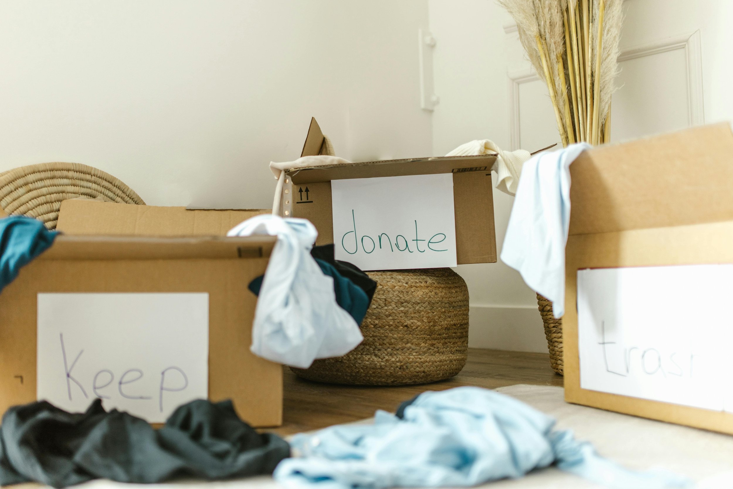 Keep, donate, and trash boxes for organizing clothes