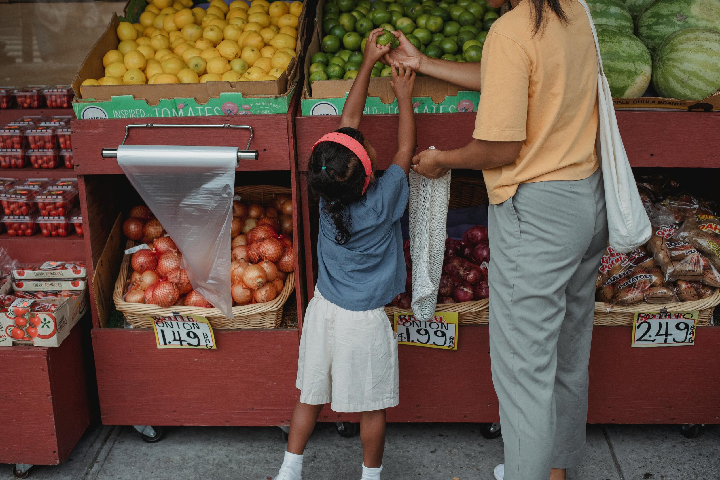 Mom and daughter at a farmers market