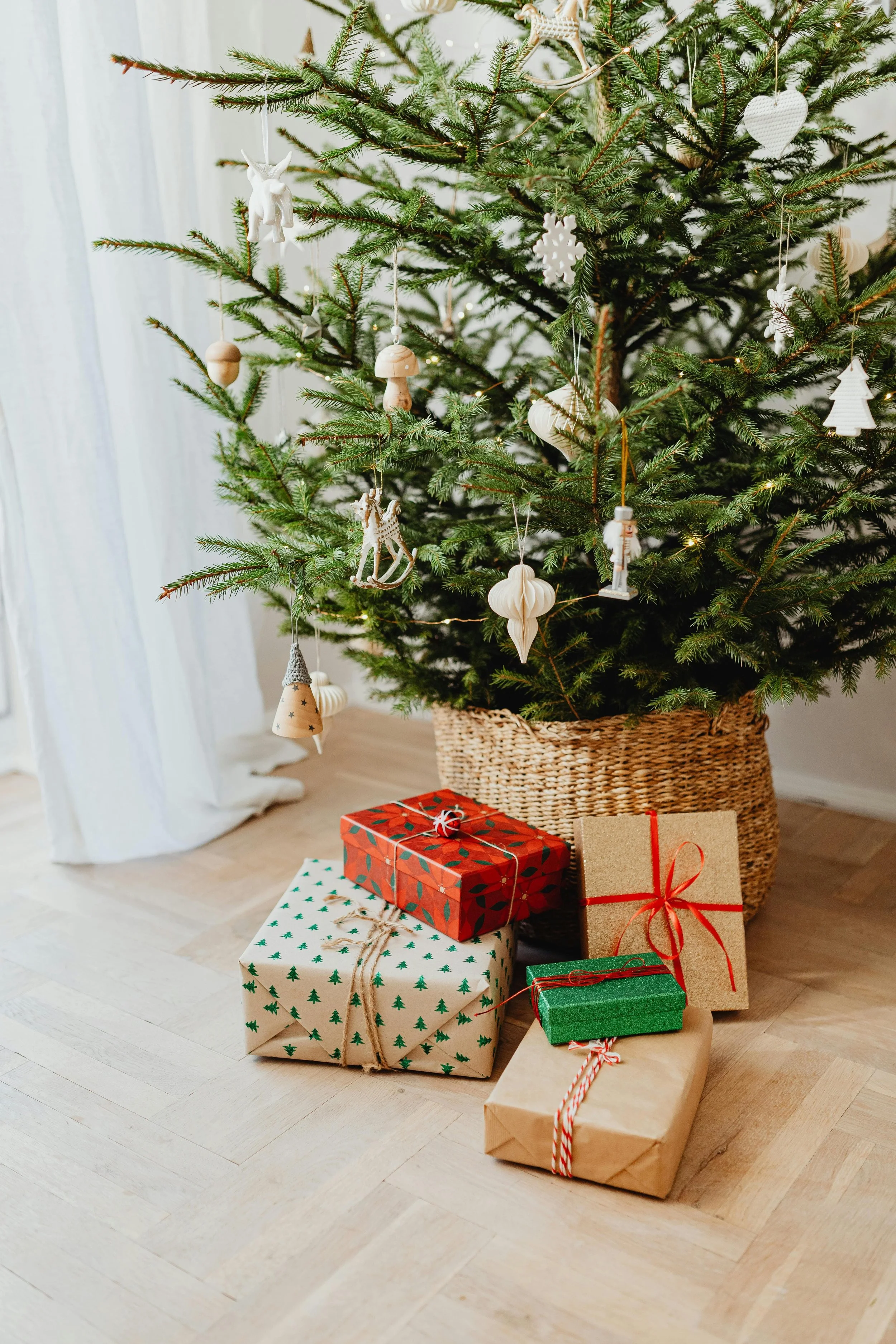 Artificial Christmas tree with presents underneath