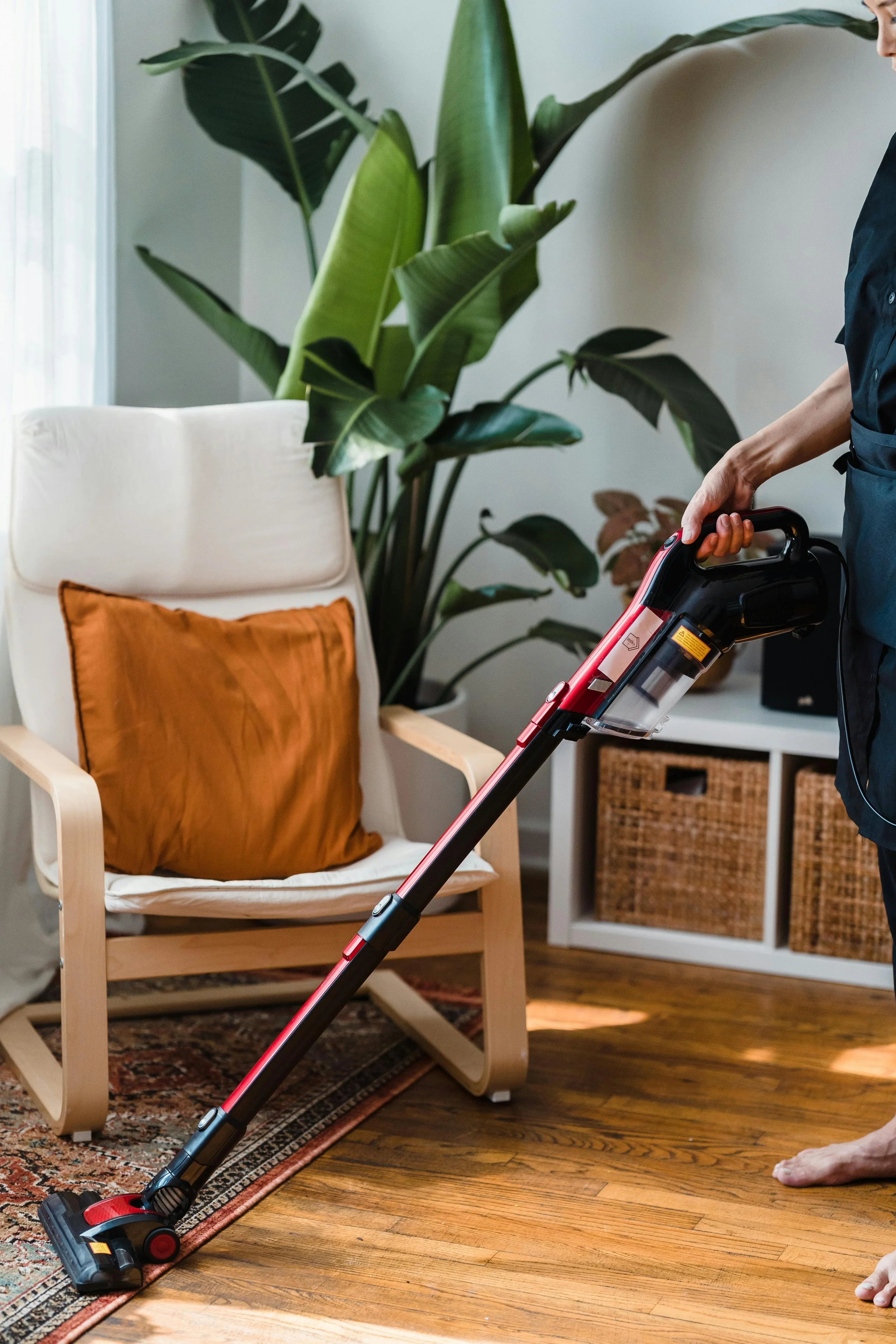 A woman vacuuming the floor