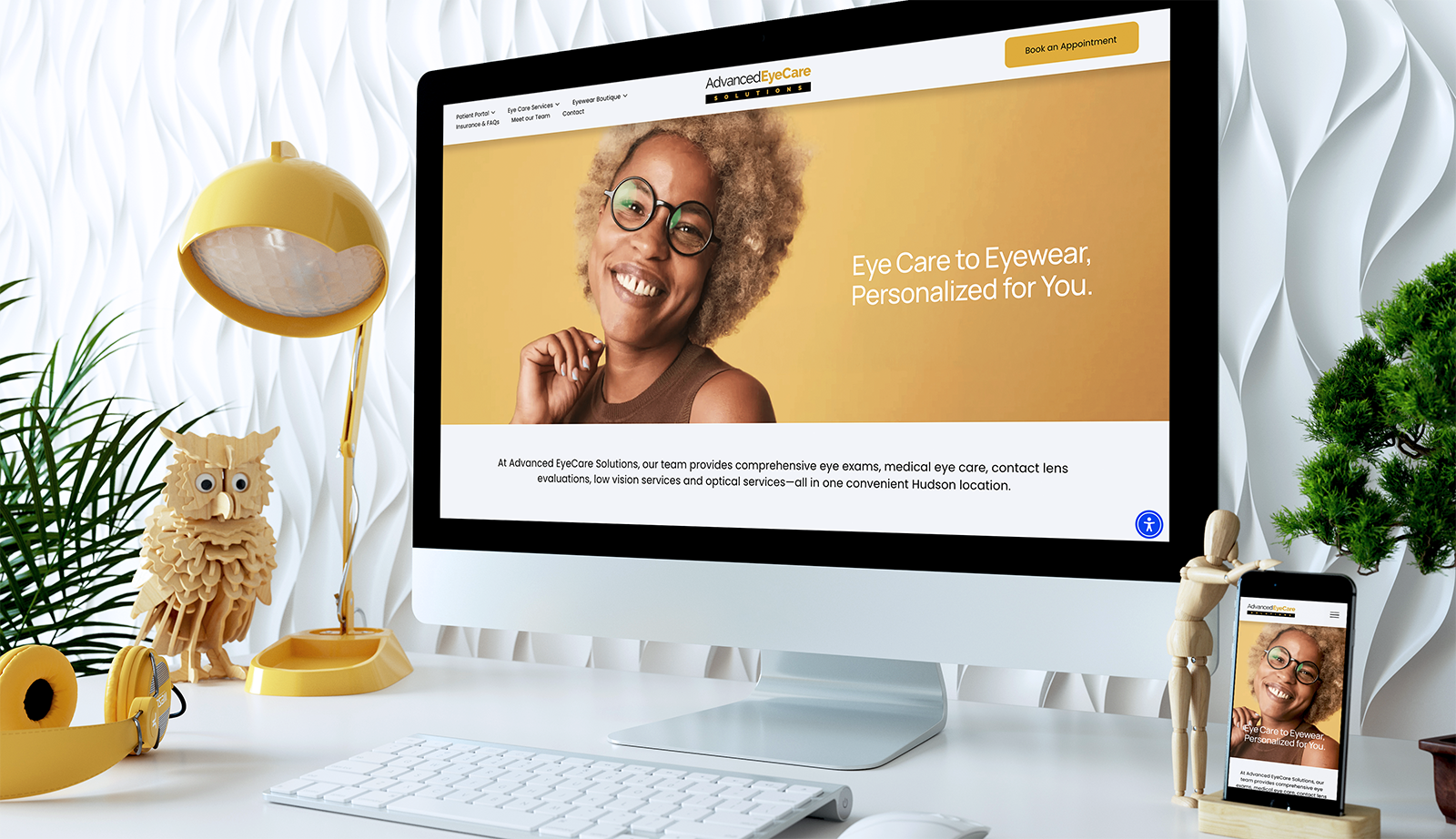 Advanced EyeCare Solutions website on a desktop monitor and phone