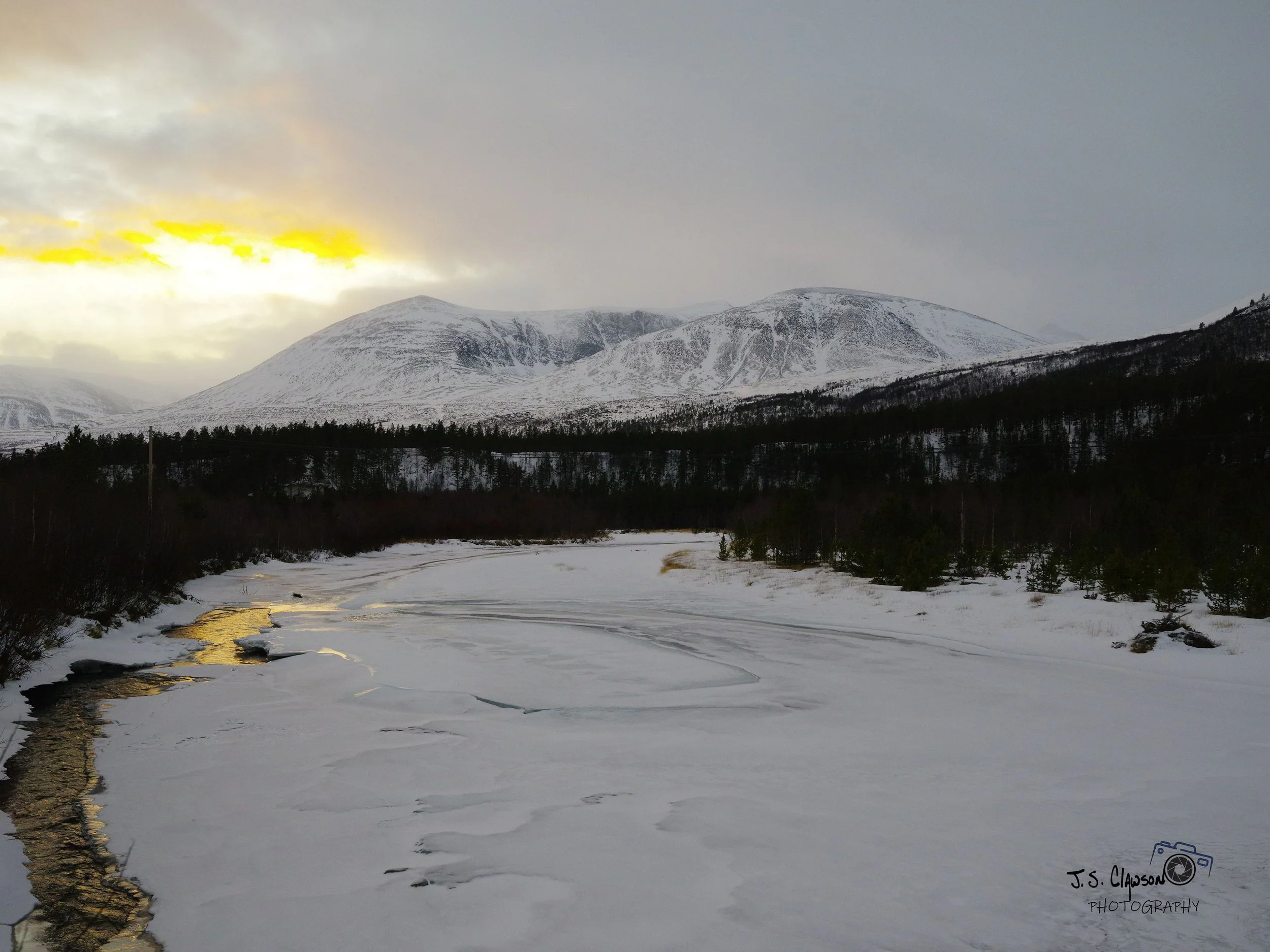 Photo by J. S. Clawson of snow capped mountains in Norway.