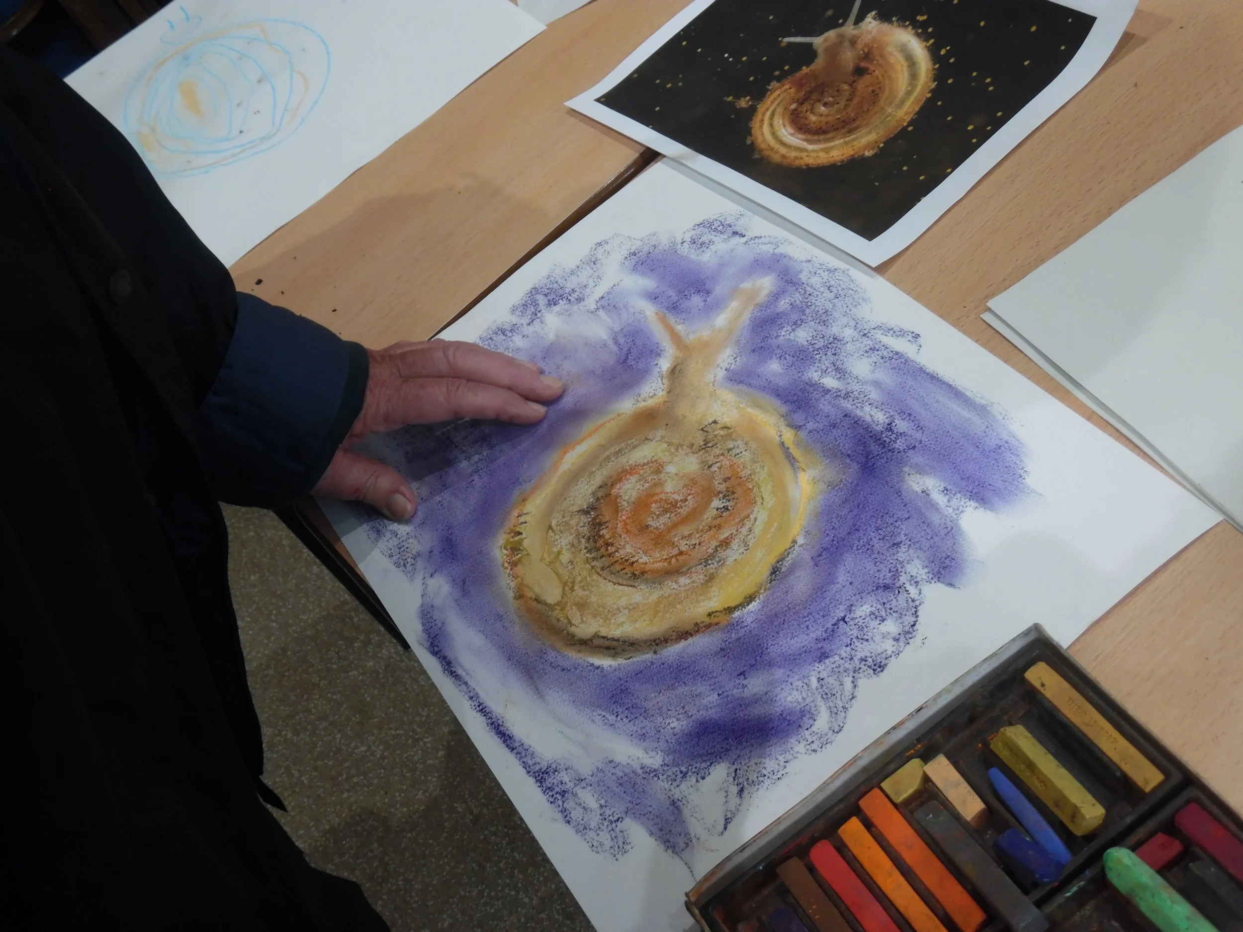 Older participant exploring chalks
