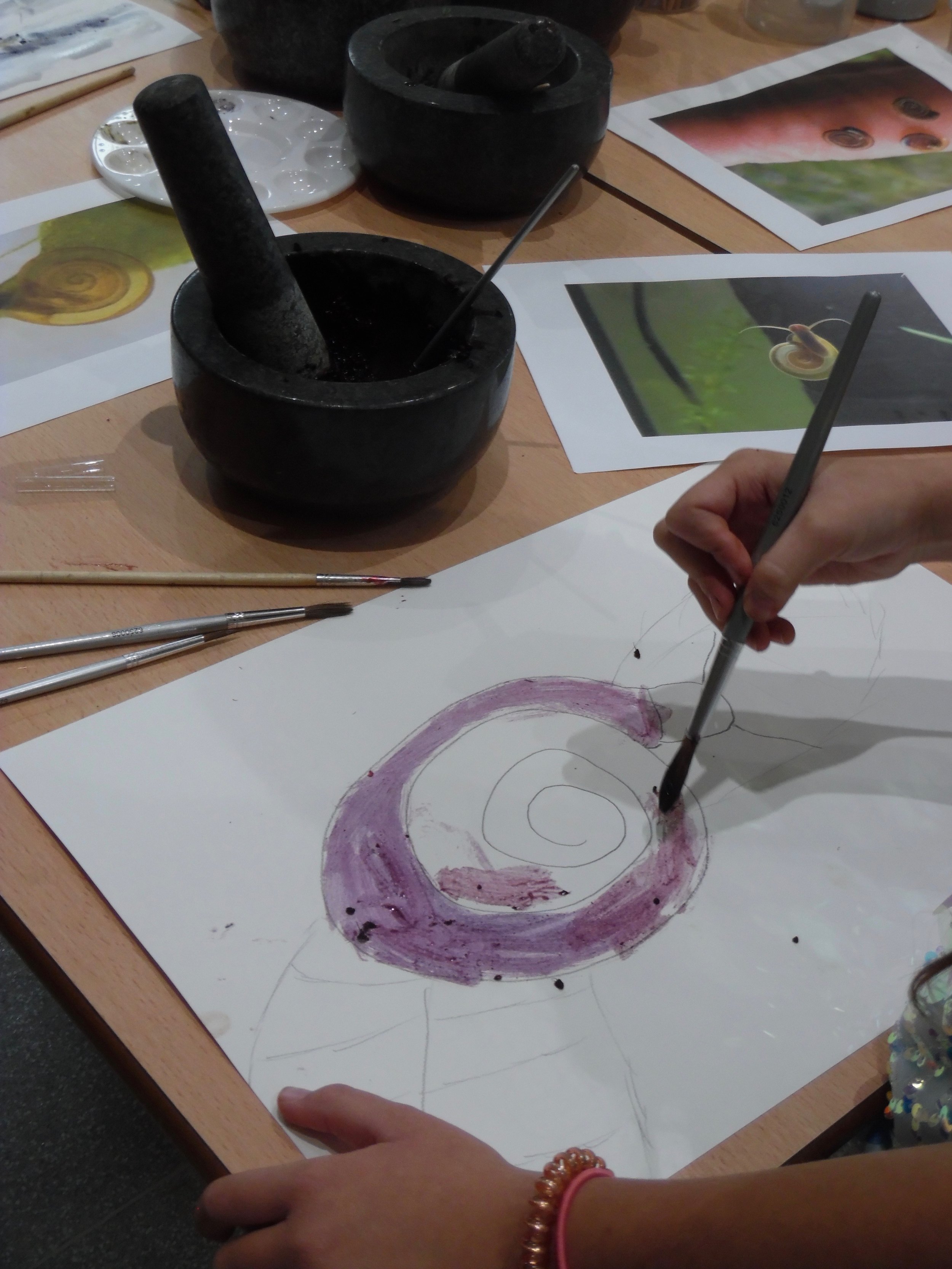 Painting with natural ink we created from berries foraged at the nature reserve
