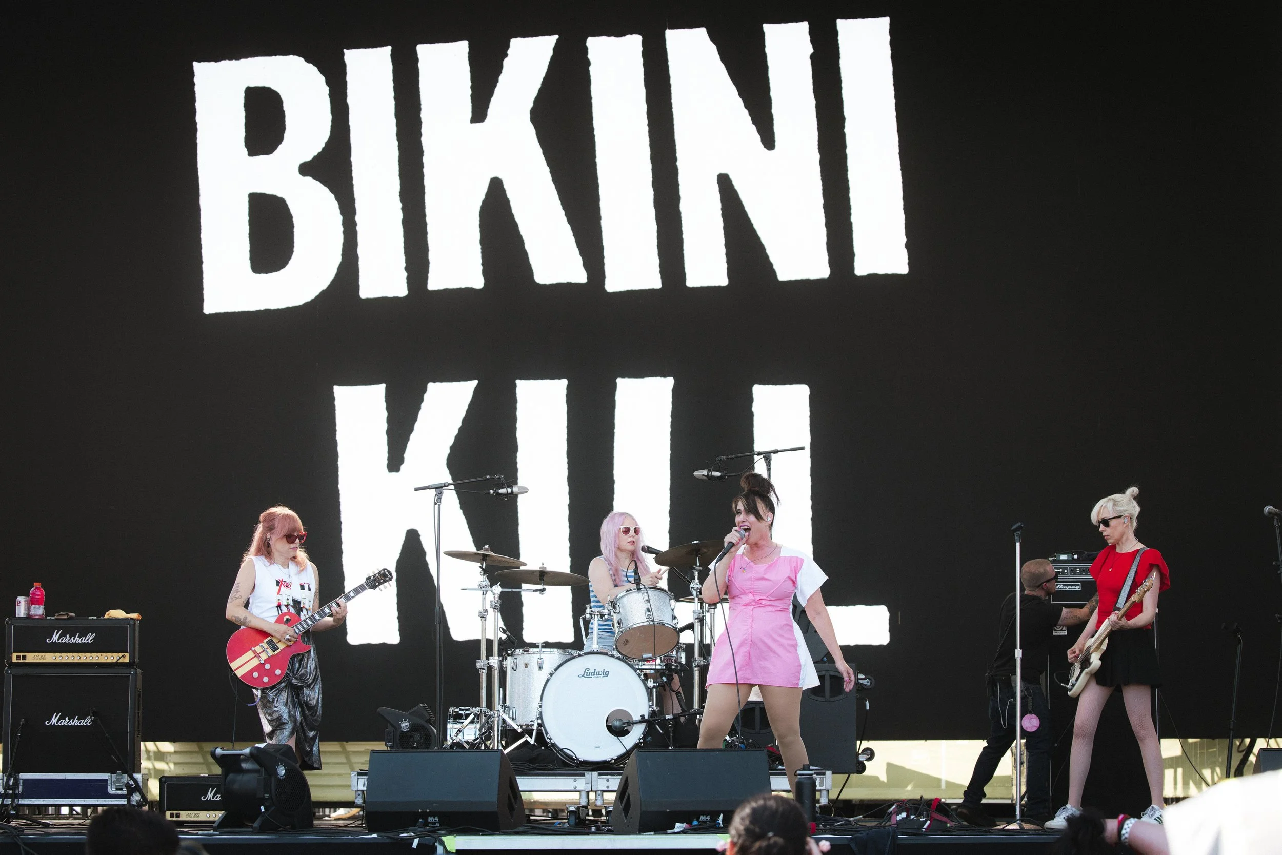 Bikini Kill at Daisy Chain Fields Festival Marigold Stage by music photographer Nicole Sepulveda