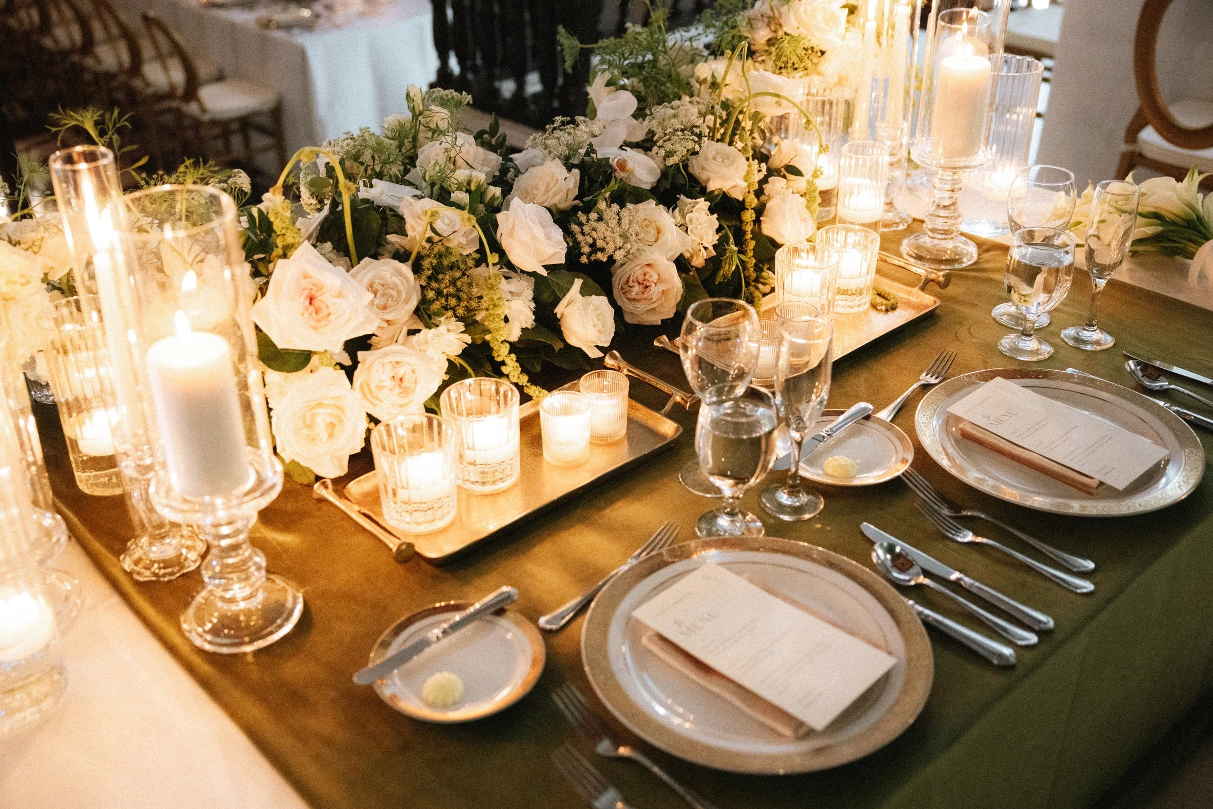 Destination wedding puerto rico head table design decor white flowers roses candles