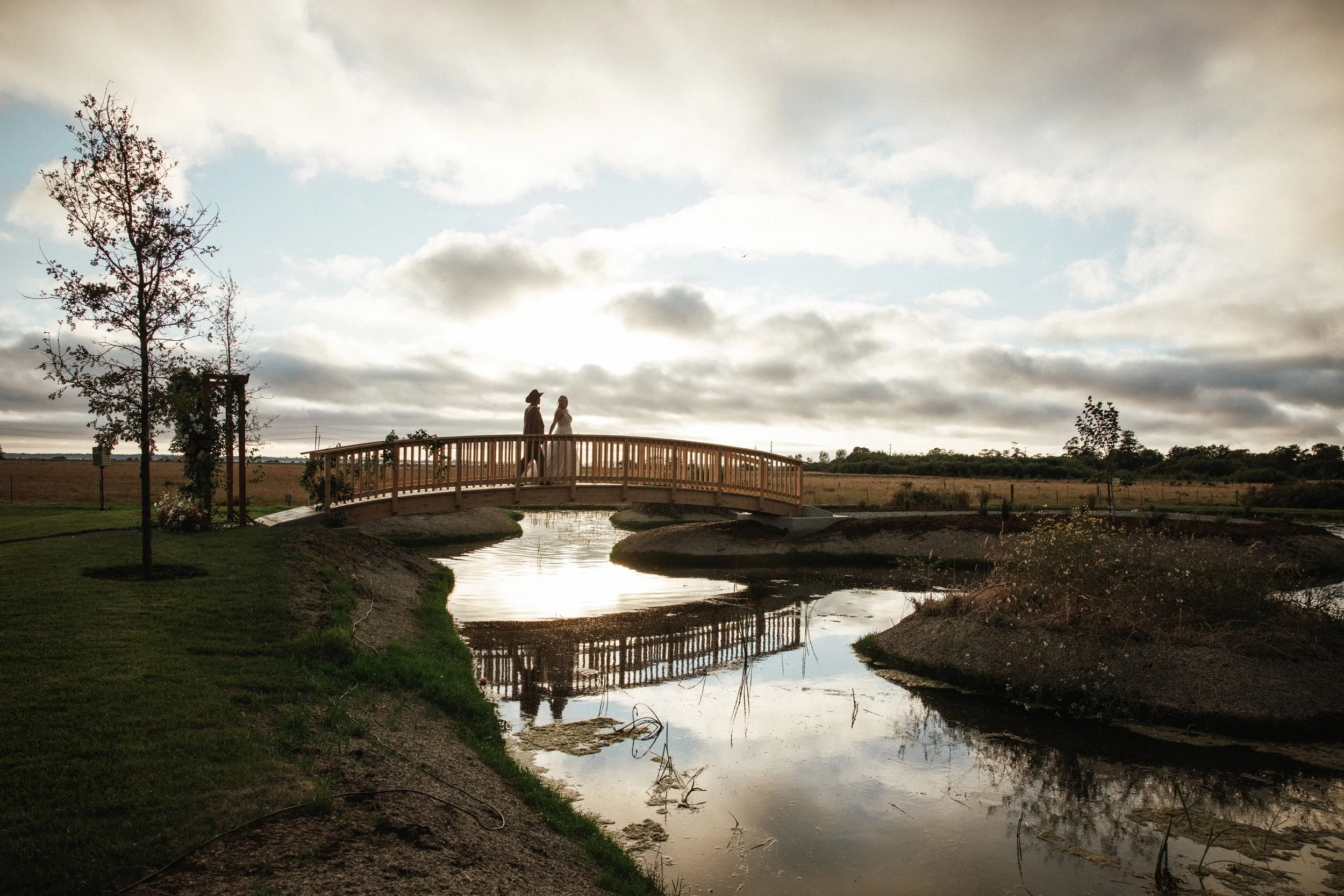 silhouette sunset romantics on bridge private estate wedding Sacramento