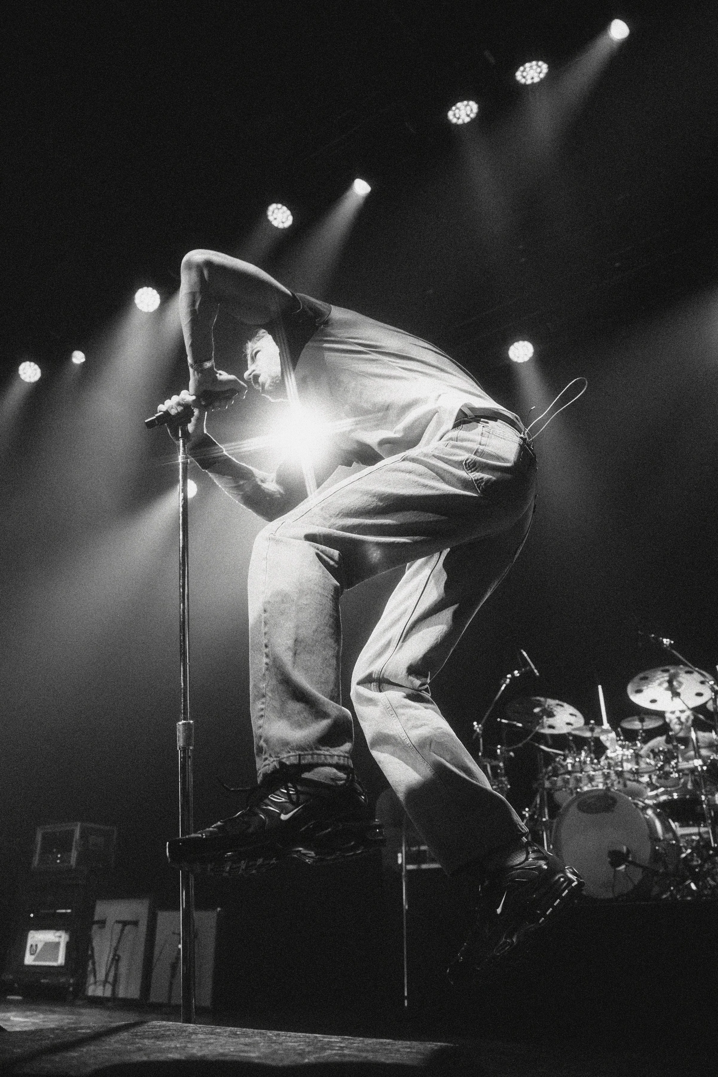 Jumping action shot of Nick Hexum (lead singer of the band 311) at Channel 24 in Sacramento CA 4/3/2026 — by Sacramento Music Photographer Nicole Sepulveda