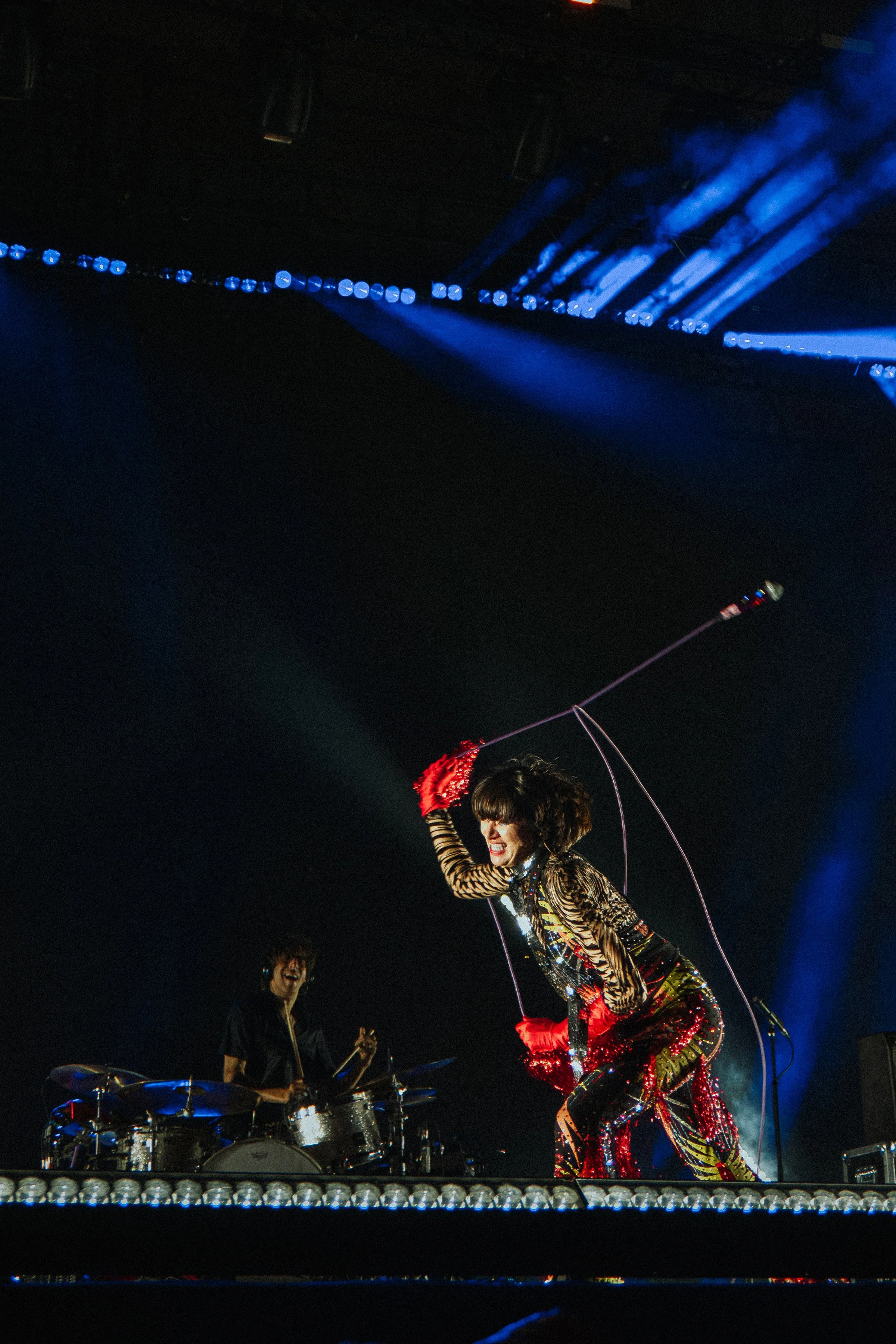 Action photo of Karen O, lead singer of the Yeah Yeah Yeahs, at the Greek Theater in Berkeley California 2023 — by San Francisco Music Photographer Nicole Sepulveda