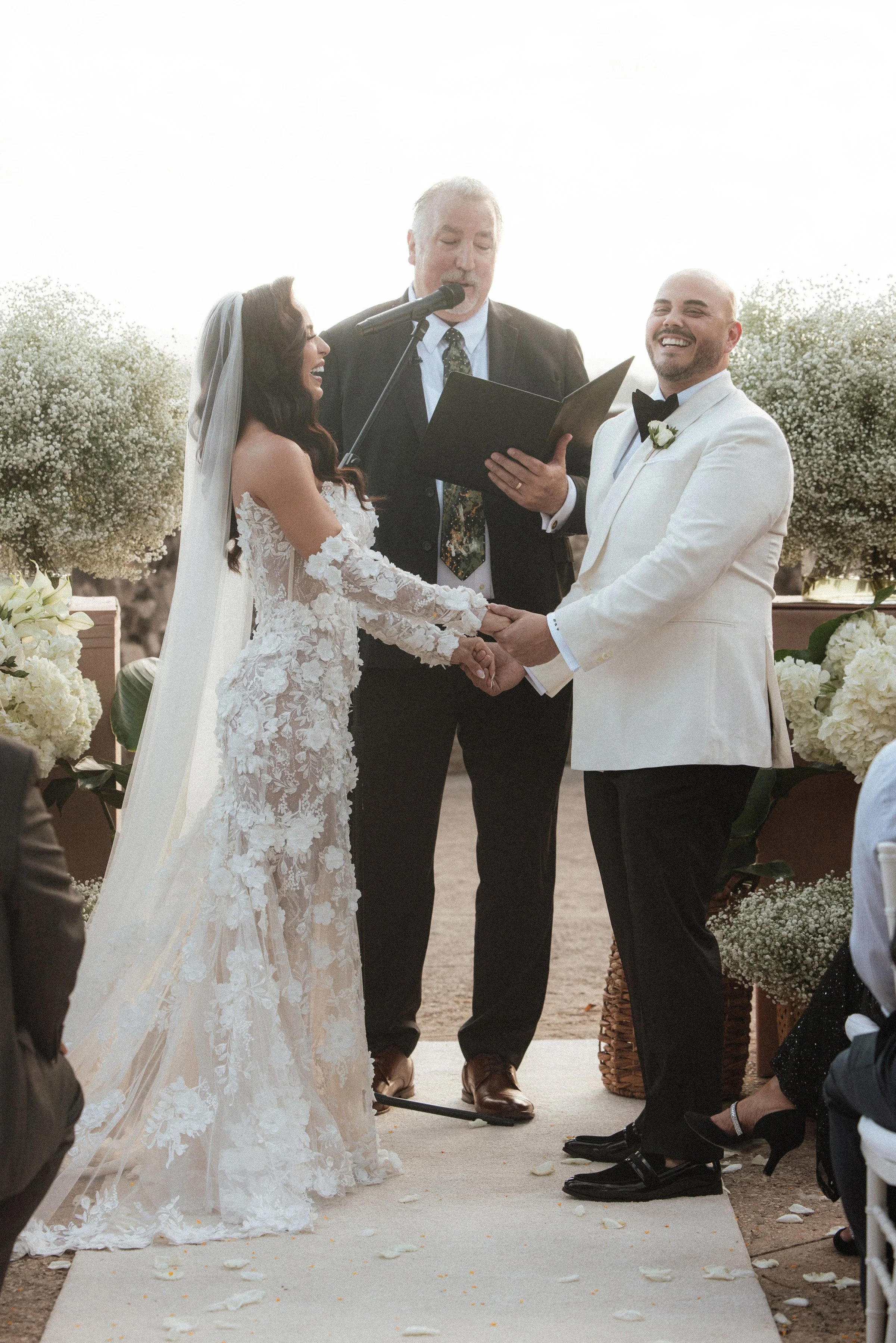 Chady Dunmore David Garibaldi wedding ceremony bride groom white florals