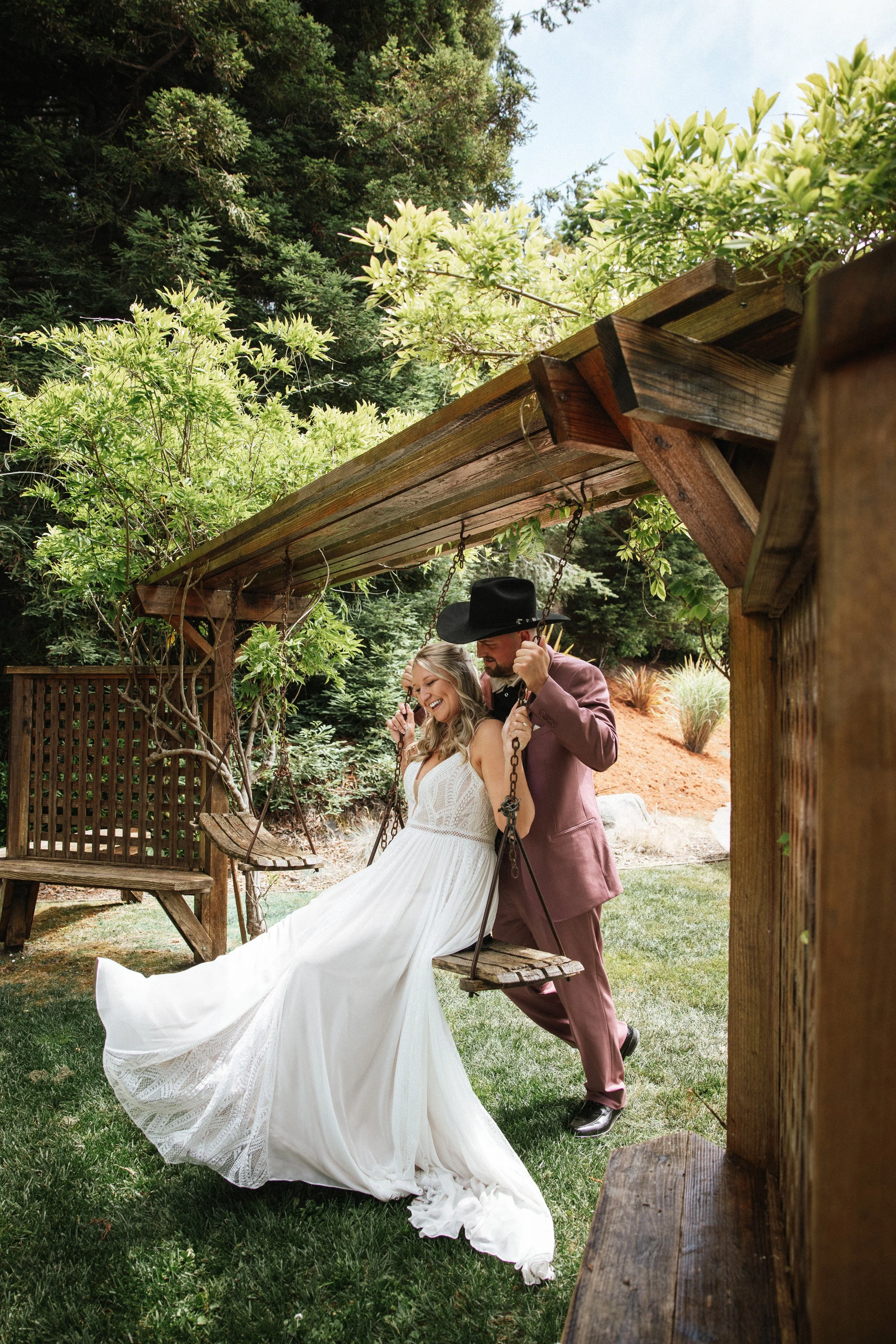Sacramento Wedding photographer eureka lost coast Mendocino private estate fun editorial photo bride and groom on swing