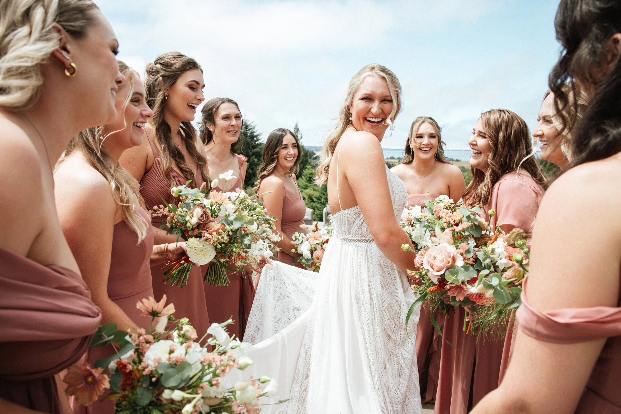 bride with bridesmaids in dusty rose pink dresses