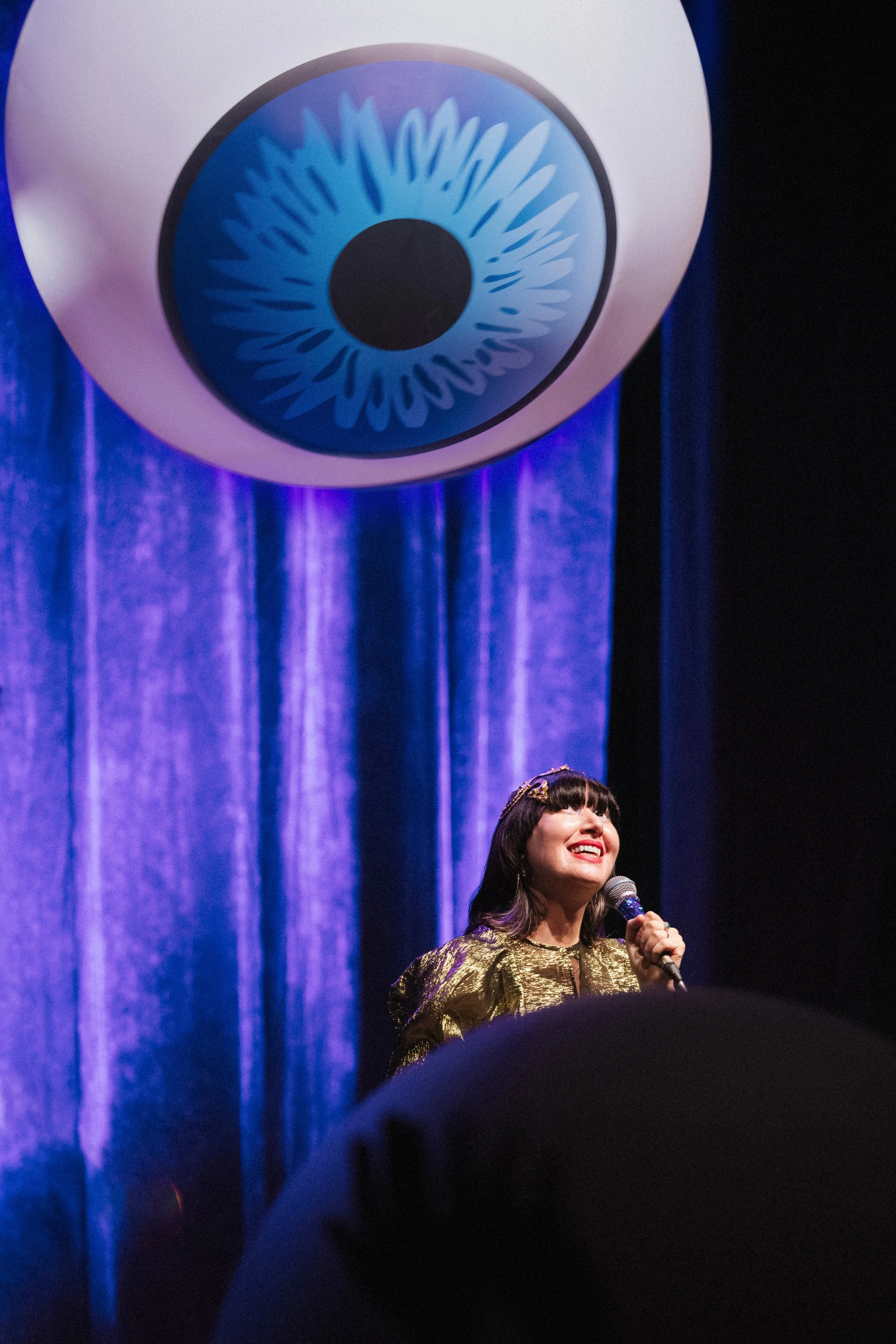 Karen O of the Yeah Yeah Yeahs eyeballing an eye prop at their last show in New York at the Beacon Theater for their Hidden In Pieces tour 7/30/2026 — by touring Concert Photographer Nicole Sepulveda
