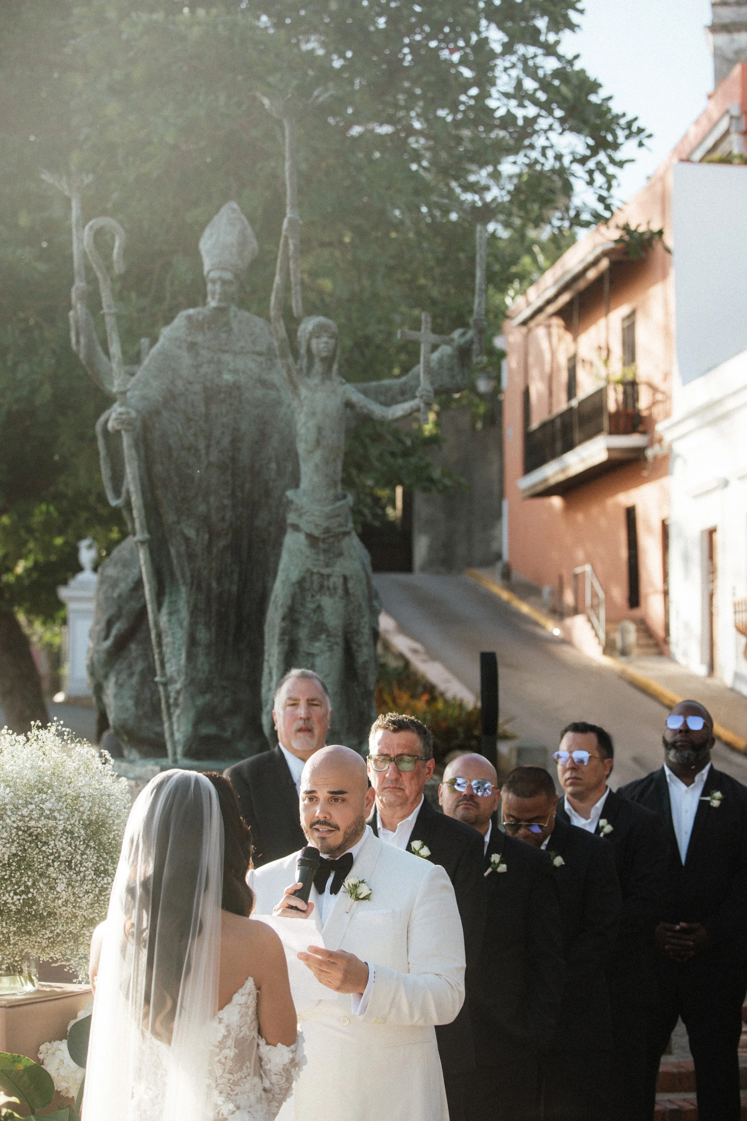 Groom reading wedding vows San Juan Puerto Rico Wedding ceremony candid