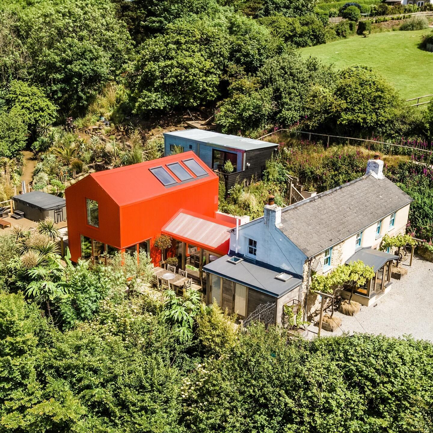 An aerial view of our red extension to an old Cornish cottage, set in a sub-tropical garden.

Photo by @loganirvinemacdougall 

#cornisharchitecture #ribasouthwest #extension #architecture #cornwall