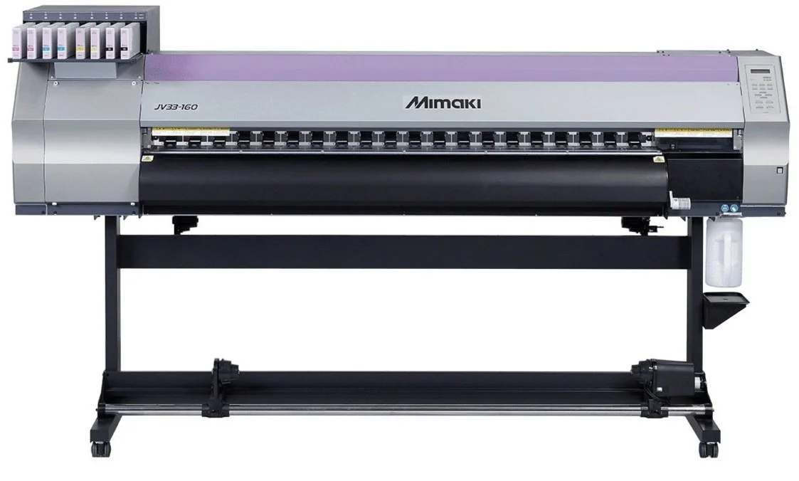 Large industrial printer with ink cartridges on the top left