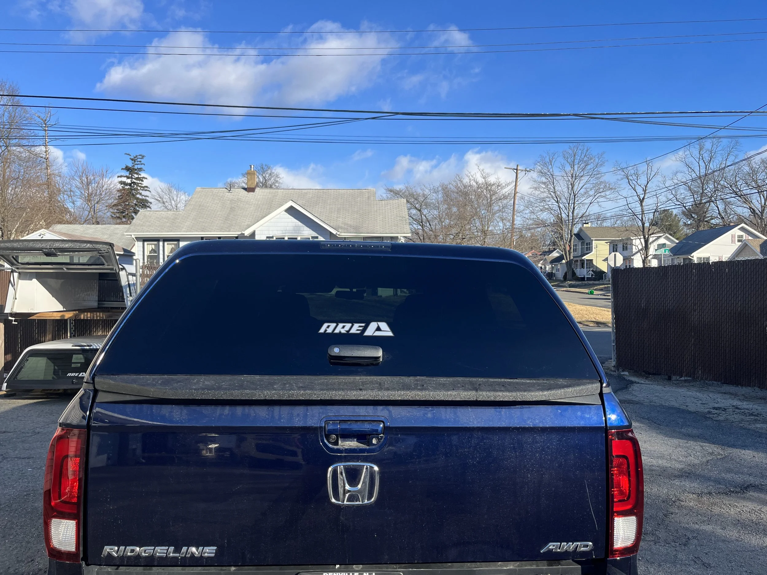 Honda Ridgeline with ARE Z Series Cap — suburbancaps.com