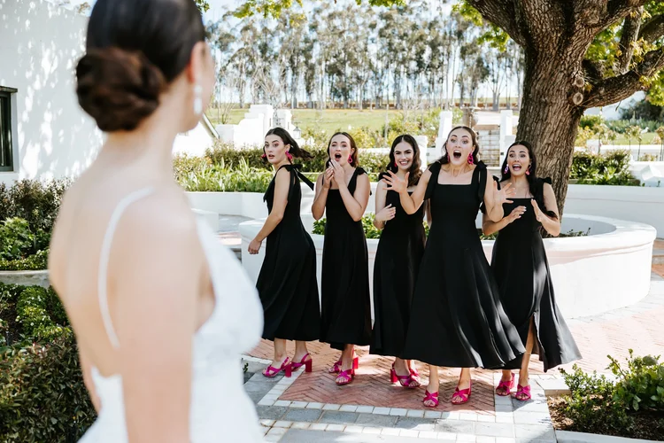Bridesmaids reacting emotionally during a wedding first look at Joubertsdal