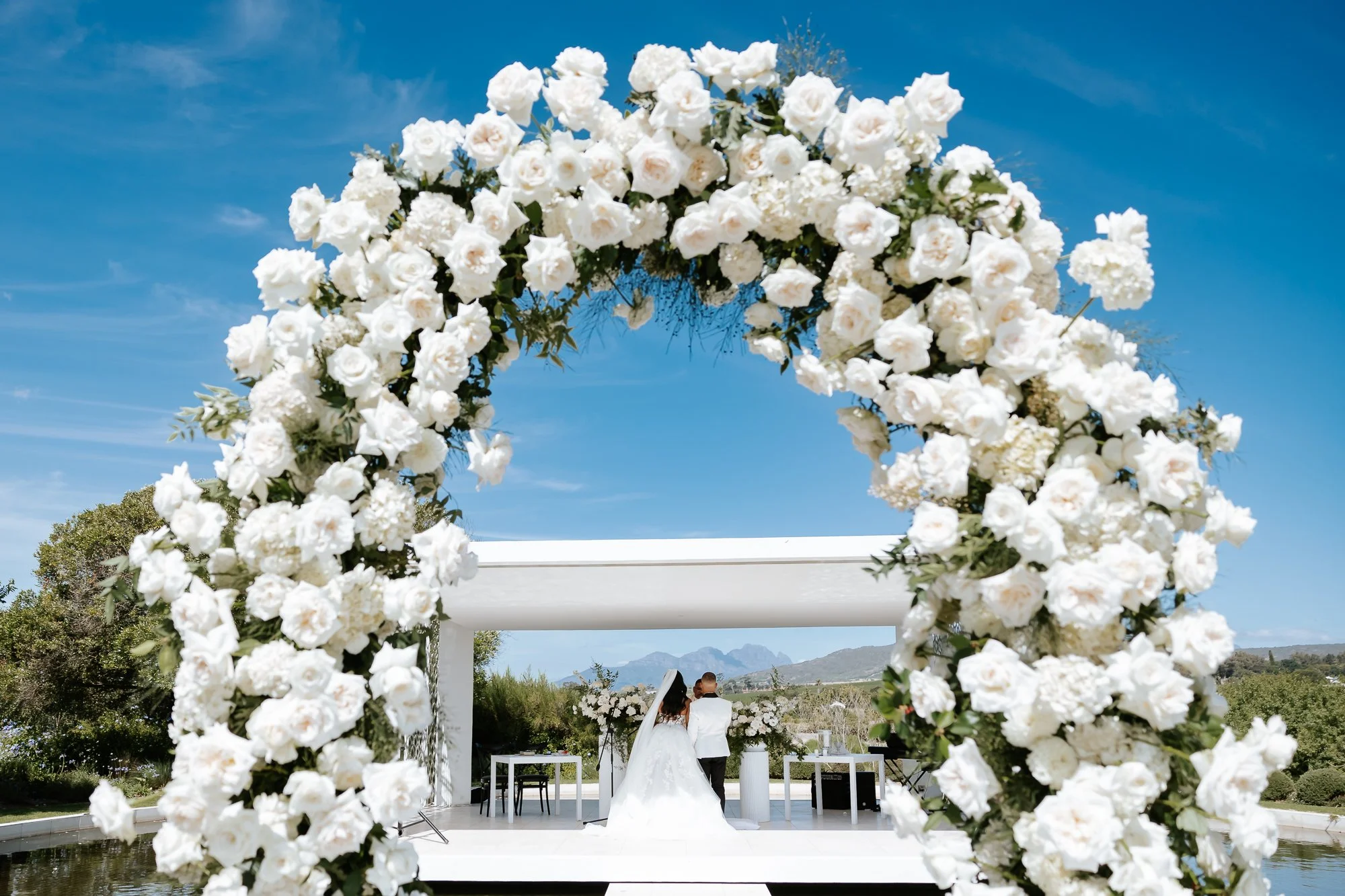 Wedding ceremony over the water at Hazendal in Stellenbosch
