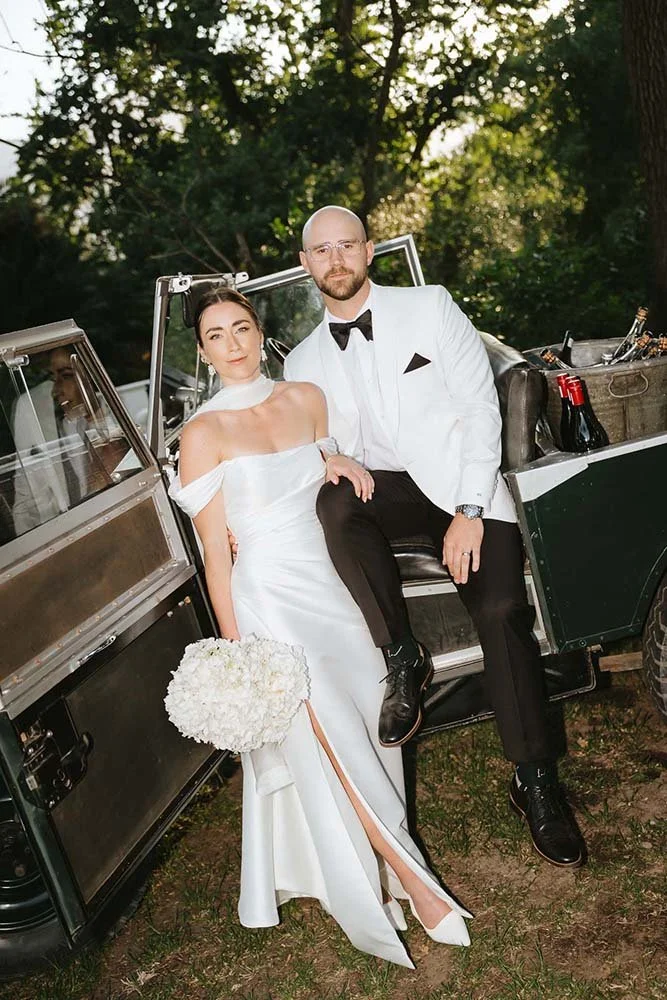 Editorial fashion photo of a bride and groom photographed in a candid way