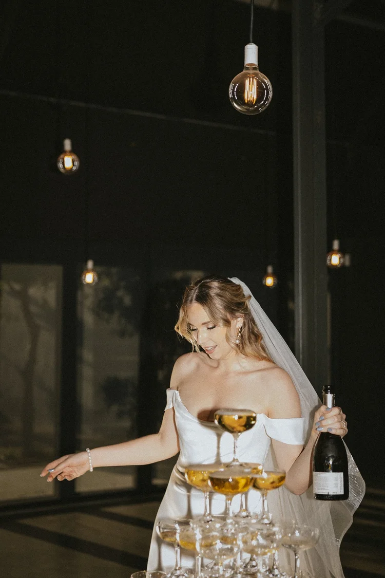 Bride celebrating with champagne