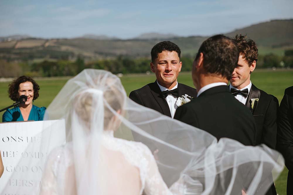 Emotional groom as the bride comes down the aisle