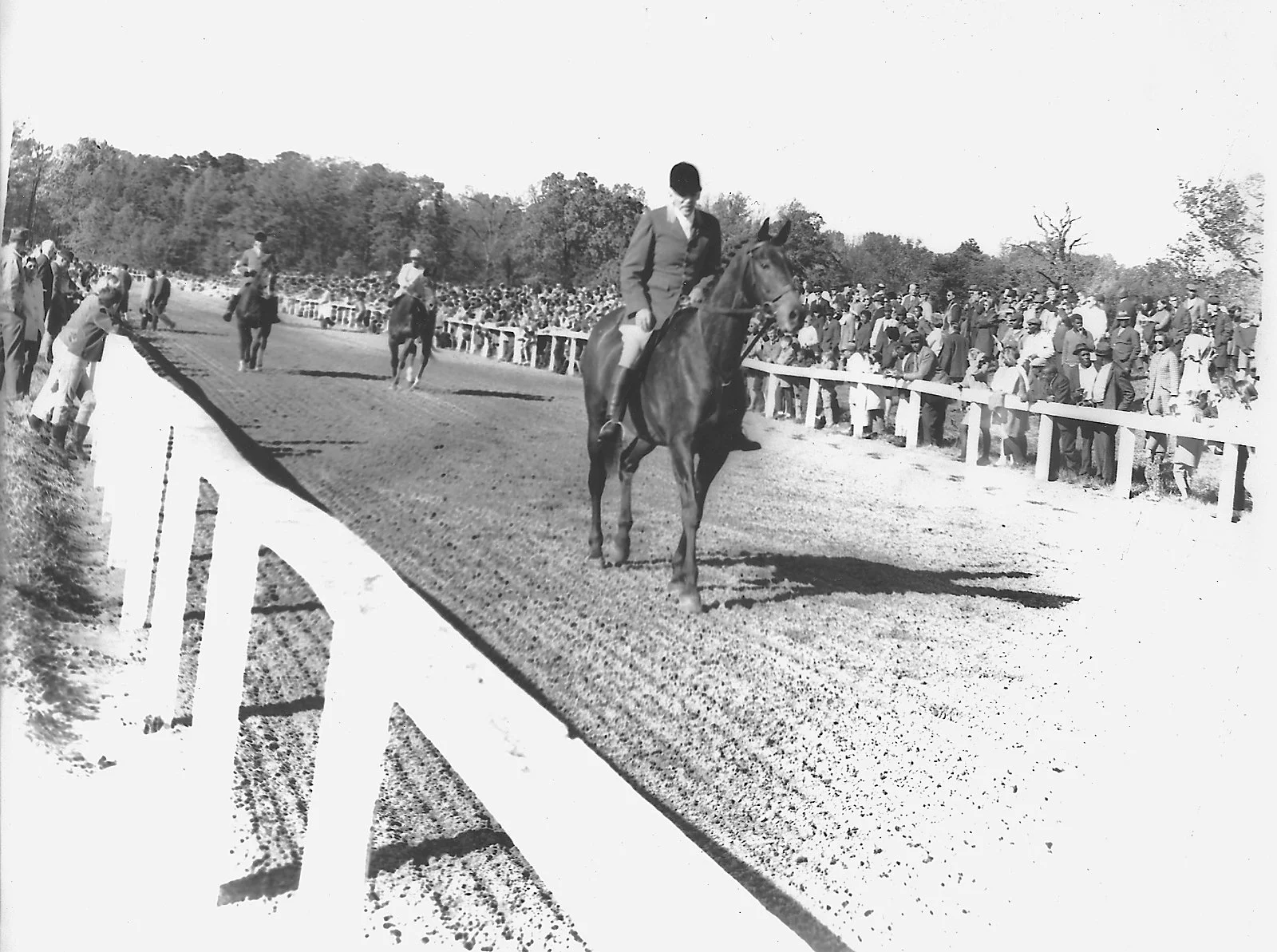 Link Brooking, long time Huntsman for Mrs. Scott,leads horses to the post as an outrider, c. 1960’s