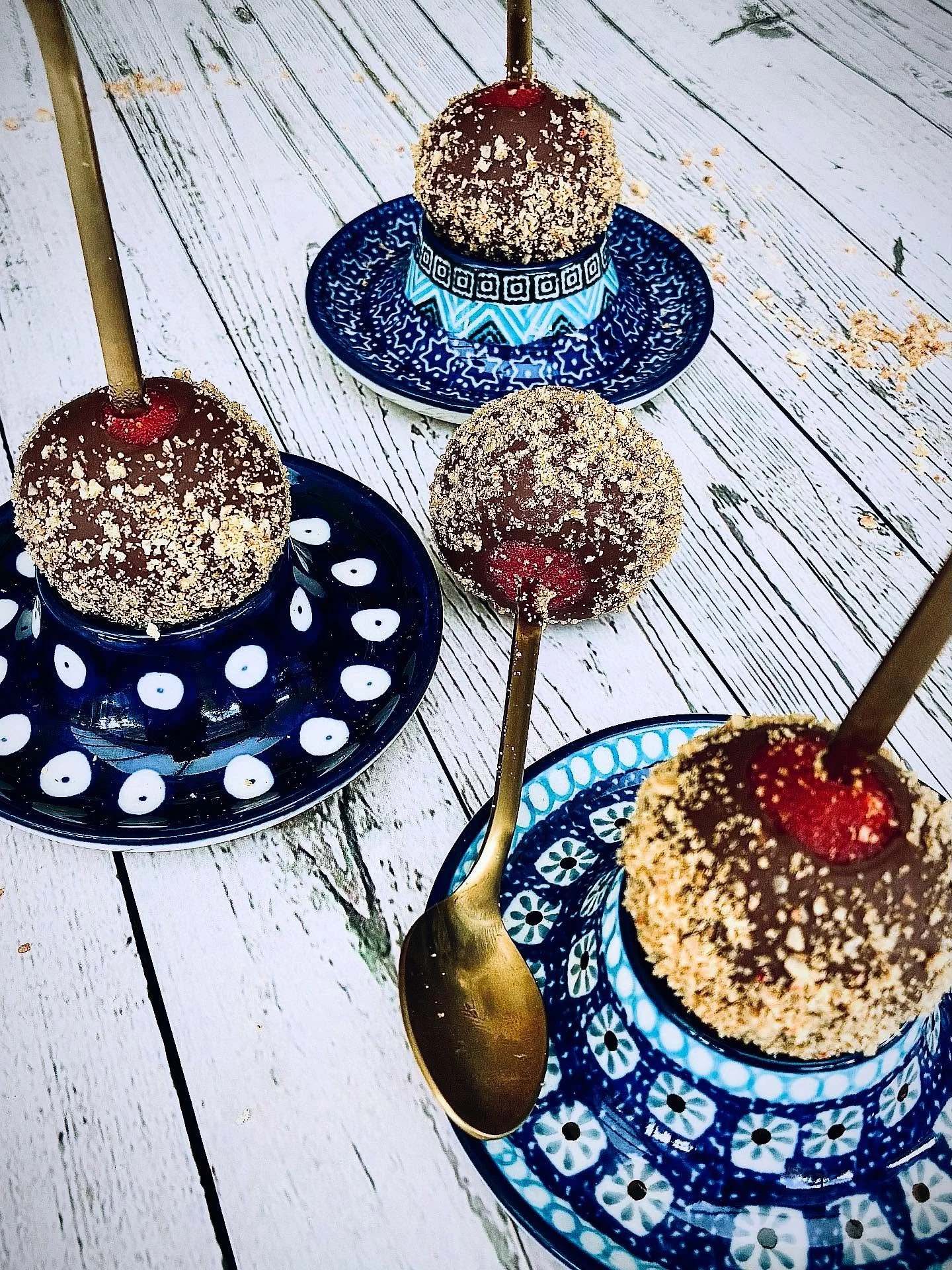 A hasty re-hash of a few-day-old birthday-party cake: red velvet &amp; chocolate cake-pops, coated in crumbled hob-nobs. 

Not the height of gastronomy, but a nice little after-school treat for a 10-year old birthday girl. 

#cakepop #leftovers #birt