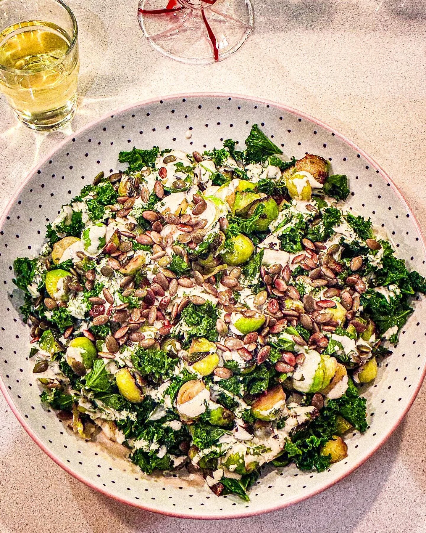 The custard may not have been over-egged, but the veg box was definitely over-sprouted.  Step forward sprout and tahini salad.

Stir-fry halved sprouts and chopped kale stalks in oil over a hot heat, add heaps of garlic, parsley and butter - keep the