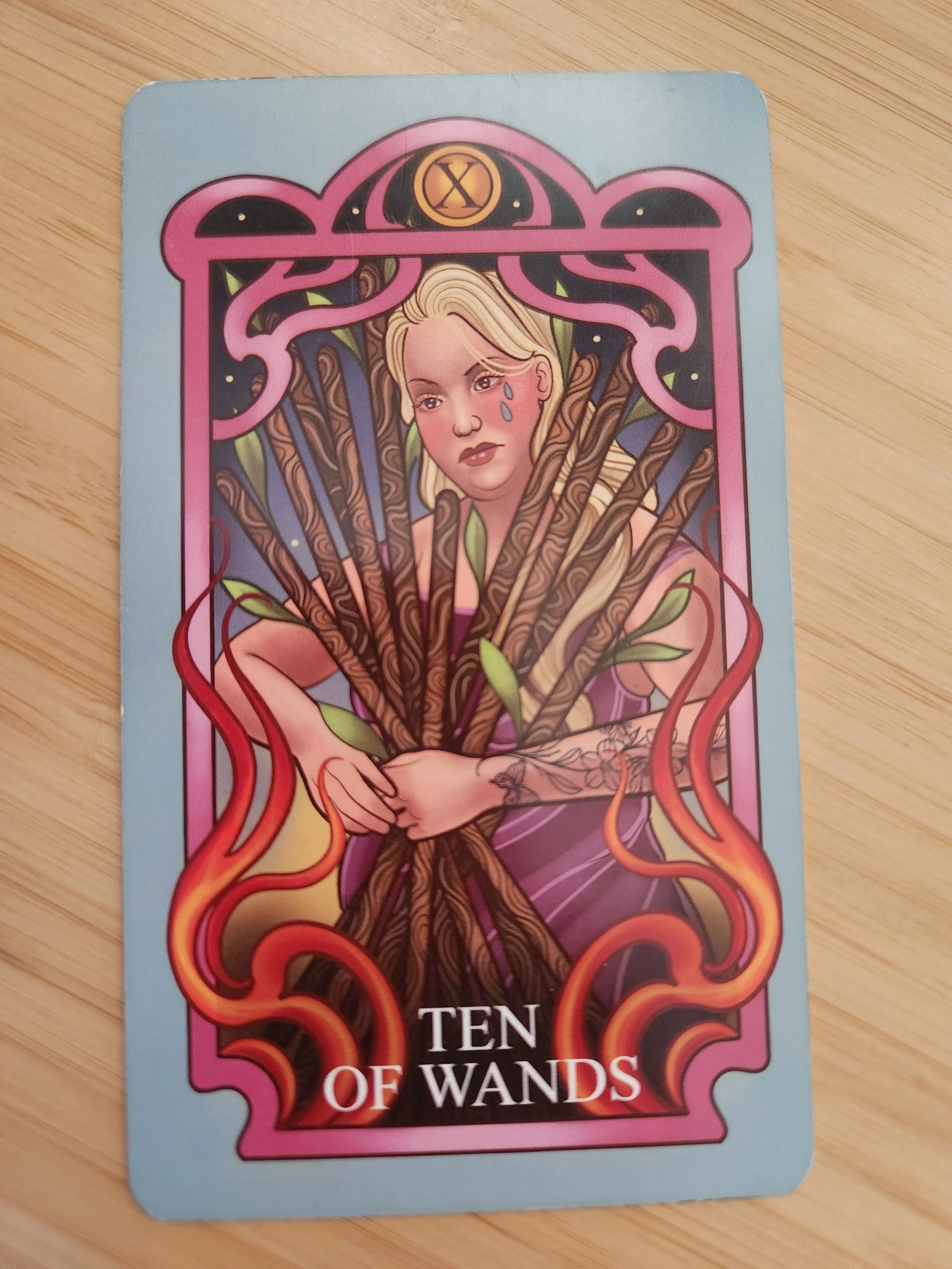 Ten of Wands tarot card showing overwhelm and carrying too many responsibilities