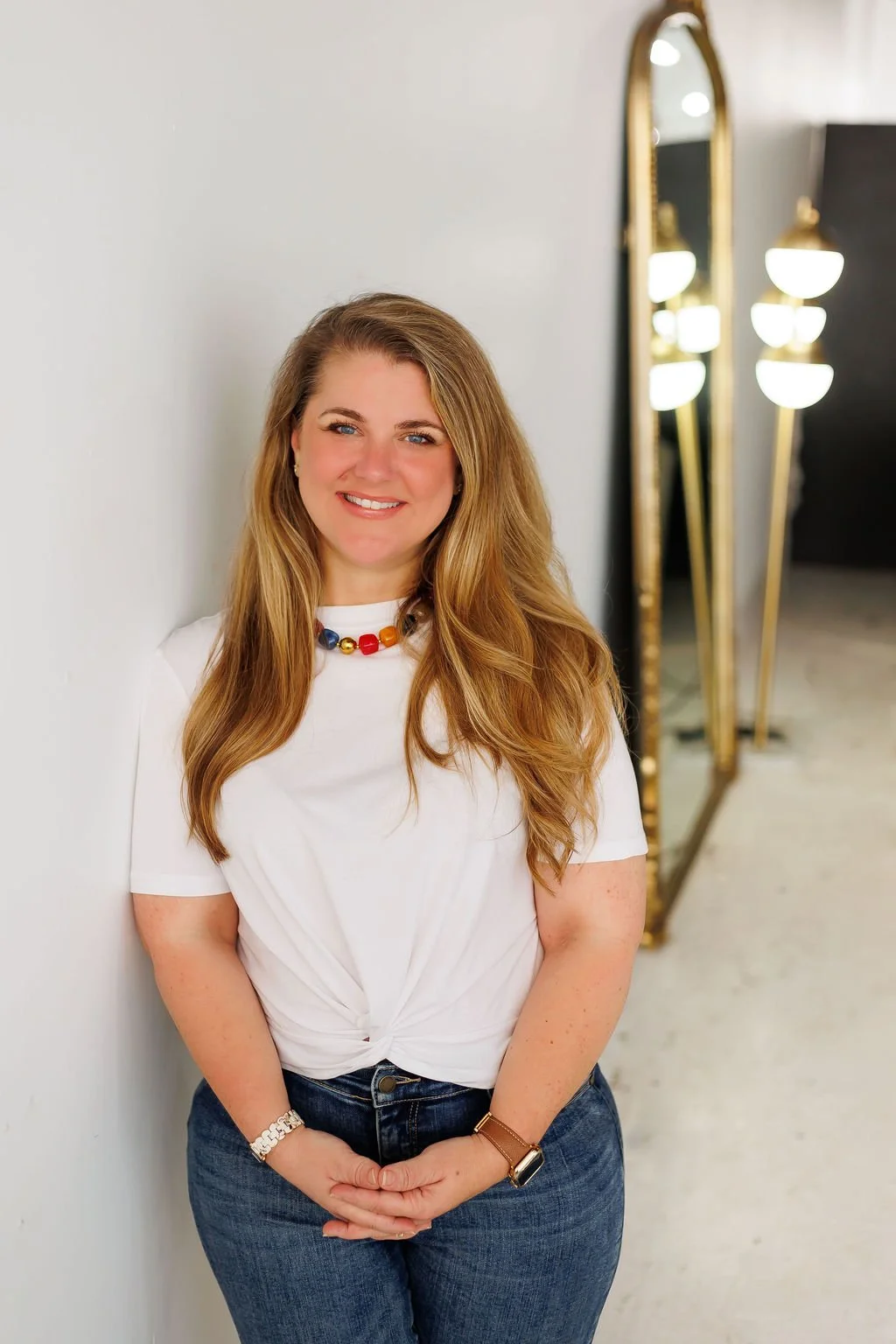Brittany Shepard, brand strategist and interior design writer smiling to camera in branding photoshoot